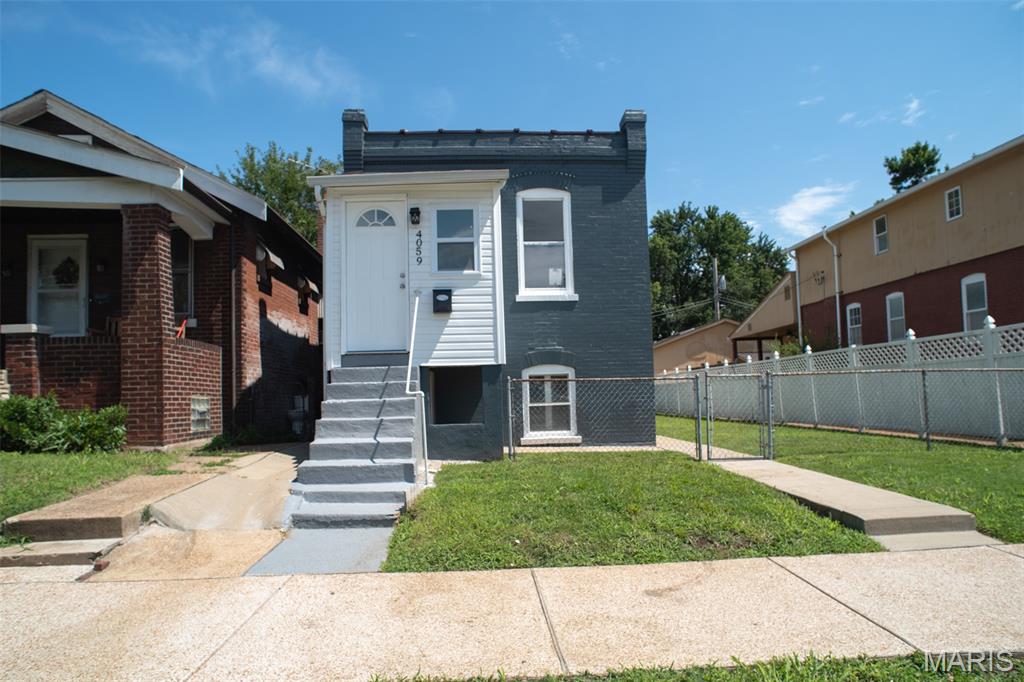 Welcome to 4059 Phillips Ave!
A great location for those who want to be close to everything the city has to offer. There's more to this home than it looks. The main floor offers a primary bedroom, full bathroom, and a bonus room that works perfectly as a home office, hobby space, or extra sleeping area. 

Head downstairs and you'll find a walk-out basement with its own bedroom, full bathroom, recreation area, and laundry room, a great setup for guests, extended family, or just extra space.

Outside, the large level backyard gives you plenty of space to enjoy, and alley parking keeps things convenient.
The home has been thoughtfully improved, fresh paint, new kitchen, new bathrooms, and new flooring, so you can move right in. 
It has already passed St. Louis City occupancy inspection, comes with a 1-year home warranty, and is ready for the new owner!

Room sizes are approximate. Buyer to verify.

SEE AGENT REMARKS