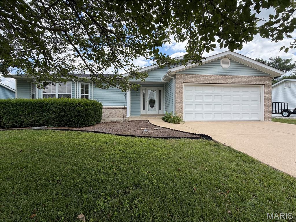 This original-owner ranch offers a combination that's becoming harder to find: a large .42-acre lot, mature trees, a finished walkout basement, and outdoor living space, all just minutes from schools, shopping, and dining.

The main level features a functional floor plan with a spacious living room, kitchen with updated countertops and select appliances, two bedrooms, a full bath, and a convenient half bath. The finished walkout lower level adds valuable flexibility with a third bedroom, second full bath, family room, laundry area, utility room, and plenty of storage space.

Outside, enjoy the new deck with metal awning overlooking the tree-lined backyard, patio area below, and hot tub ready for the next owner. The large backyard provides plenty of space to entertain, relax, garden, or simply enjoy the outdoors.

Well maintained by the original owner, this home offers an excellent opportunity to update cosmetics and make it your own. If you're looking for a solid home with a flexible layout, finished walkout basement, large lot, and room to add your personal touches over time, this may be the opportunity you've been waiting for.