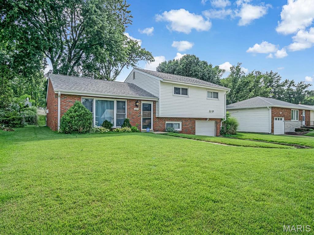 Welcome home to this well-maintained split-level offering comfortable living spaces and thoughtful updates throughout the years! Step inside to a bright and inviting living room featuring luxury vinyl plank flooring and a large front window that fills the space with natural light.

The living room flows into the eat-in kitchen, complete with a designated dining area, breakfast bar, and plenty of space for everyday meals or entertaining.

Upstairs, you'll find three bedrooms, each with hardwood flooring, along with a full bathroom. The lower level offers a convenient laundry area, half bath, and additional storage space.

Step outside to enjoy the fully fenced backyard featuring a concrete patio, perfect for grilling, relaxing, or letting pets and kids play. An attached one-car garage provides additional convenience.

With updates made throughout the years and pride of ownership evident inside and out, this move-in ready home is ready for its next owners to make it their own!
