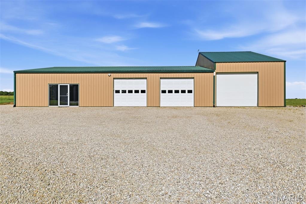 Missouri Wine Country Barndominium on 13.7± Acres with a Pond and Heated Shop! Welcome to one of the most versatile and thoughtfully updated properties in the heart of Missouri Wine Country. Nestled on 13.7± acres just minutes from the charm of downtown Hermann and the region's celebrated wineries, this stunning Barndominium offers approximately 3,200 square feet of beautifully finished living space, jaw-dropping workshop capacity, and the kind of lifestyle flexibility that's nearly impossible to find — all in one exceptional package. Shop Space That Means Business Attached directly to the living quarters is an impressive climate-controlled garage and workshop built for serious use:  Primary garage/workshop: 40' × 33' is Insulated, heated & cooled with two oversized 8.5' × 10' garage doors.  Secondary attached garage: 20' × 40' with a 10' × 12' overhead door ideal for RVs, boats, trailers, farm equipment, or recreational vehicles.  Whether you're a car enthusiast, tradesperson, hobbyist, or entrepreneur, this workspace delivers the square footage and infrastructure to support virtually any vision. Income Potential & Outdoor Appeal with Approximately 10 acres currently in hay production provide a built-in income stream or a natural starting point for hobby farming operations. Outside, enjoy sweeping panoramic countryside views, mature trees, and a private pond perfect for fishing, paddle boating, or simply unwinding at the end of the day. The long gravel drive and expansive parking area accommodate customers, guests, large equipment, and oversized vehicles with ease. A Residence Built for Real Living!!! Step inside to soaring ceilings adorned with rich wood beams, fresh paint throughout, and durable luxury vinyl plank flooring that sets a warm, modern tone. The open-concept great room flows seamlessly from a generous living area to a comfortable dining space, with a secondary sleeping area tucked toward the front of the home that offers privacy and effortless conversion potential for another bedroom. The oversized primary suite features a walk-in closet and access to a beautifully appointed full bath complete with an oversize granite vanity, new tub/shower combo, and updated fixtures and hardware. Main floor laundry adds everyday convenience to this already smartly designed floor plan. The showstopper kitchen impresses at every turn with 42-inch upper cabinetry, updated hardware, rustic wood shelving, and a custom breakfast bar built on whiskey and wine barrel bases with a butcher block countertop that perfectly captures the spirit of Missouri wine country. Full appliance package included. Thoughtful finishing touches throughout, including new barn doors, custom trim, wood ceiling beams, wood blinds, and tinted windows and exterior doors give this home a cohesive, curated feel that move-in-ready buyers will appreciate. The Opportunity - This property checks every box for a full-time residence, weekend retreat, hobby farm, nightly rental investment, or business headquarters and it's conveniently close to the city without sacrificing a single acre of country charm. All-electric construction keeps operating costs practical, and the updated condition means you can move right in.  Farm, Residential or Commercial Uses Possible - Properties like this don't come along often.  Schedule your private showing today and experience it for yourself.  (See MLS #26033181 or 26036684 or 26036716)