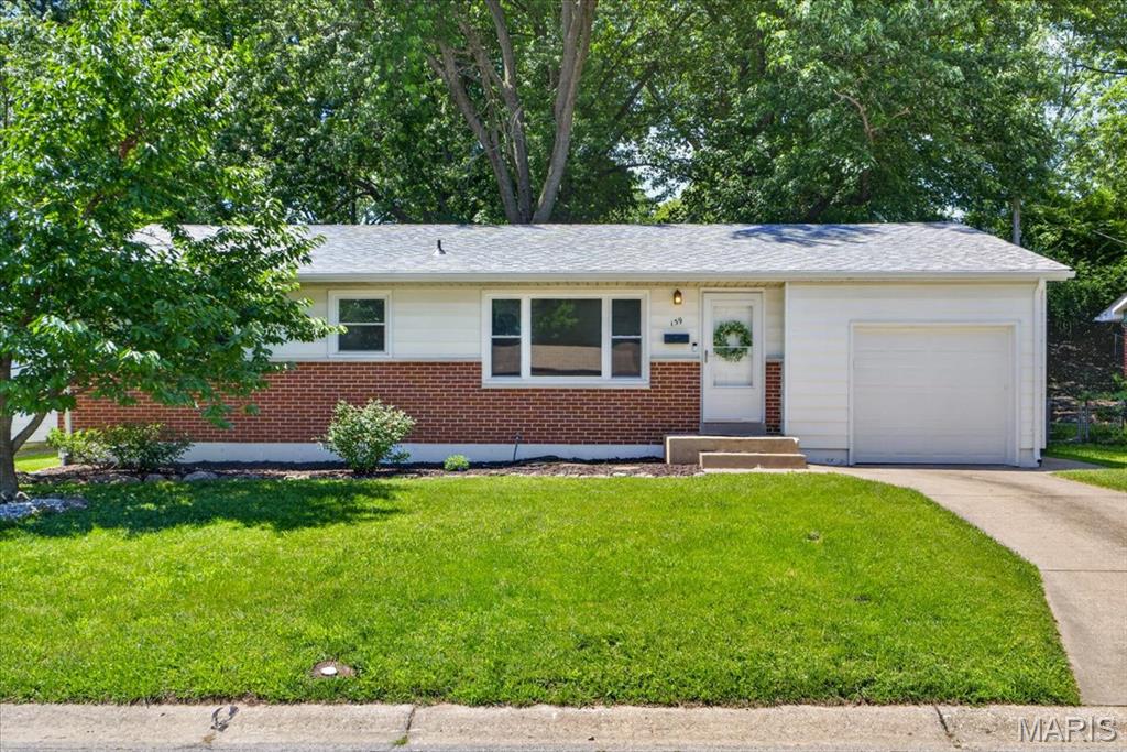 Welcome to 139 Woodlawn Drive, a charming Saint Charles ranch with inviting curb appeal, useful updates, and a practical layout ready to meet your needs! The main level features newer flooring, two bedrooms, a full bath, and a bonus room that gives the floor plan flexibility. Use this space as a dining room, office, playroom, sitting room, or explore converting it to a third bedroom! Recent improvements include a new roof, fresh paint, updated fixtures, recessed lighting, and newer kitchen appliances. From the spacious eat-in kitchen, entertainment is made easy with access to the large back patio and fenced yard with mature trees. The partially-finished basement boasts ample storage space, a second full bath, and room for your projects, hobbies, or future finishing potential. An attached one-car garage adds more practical use, and a one year home warranty is included for buyer’s peace of mind! Located near quaint shopping and dining favorites like the Streets of St Charles, easy highway access, and historic Main Street, this home offers a solid opportunity in a well-connected location.