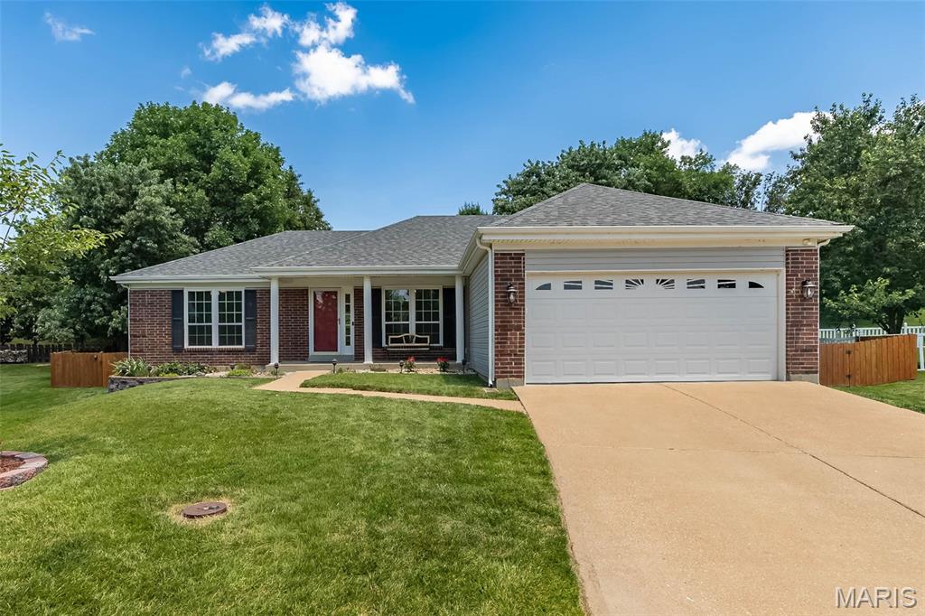 Welcome home to this beautifully maintained 3-bedroom ranch nestled on a quiet cul-de-sac in a sought-after neighborhood! Designed with a desirable split-bedroom floor plan, this home offers both privacy and comfortable everyday living. The spacious vaulted great room features a cozy fireplace, creating the perfect gathering space for family and friends.  The kitchen boasts elegant quartz countertops, gas range and microwave, along with stainless refrigerator and flows seamlessly into the bright breakfast room with a charming bay window and sliding glass door that opens to the patio and fully fenced backyard—ideal for outdoor entertaining, pets, or simply relaxing.  The primary suite is privately situated away from the secondary bedrooms, while the convenient one-level layout makes daily living effortless. 2 additional bedrooms and full bath complete the main floor.  The open staircase leads to a partially finished lower level with bonus rooms, office bedroom potential, family room and roughed-in full bath plumbing, along with tons of storage space! Located within the highly acclaimed AAA Rockwood School District, this home also offers outstanding neighborhood amenities, including a community pool, tennis and pickleball courts, providing recreation just steps from your door.  Don't miss this wonderful opportunity to enjoy comfortable living in an exceptional location!