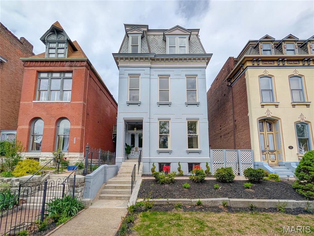Open Saturday, June 6th 10-3!! Rare opportunity to own a slice of one of St. Louis' most iconic neighborhoods! This Lafayette Square STUNNER has been renovated top to bottom, inside and out.  From the moment you enter, you'll be in awe of the original architectural details on all three floors of this home, starting with the showpiece staircase that winds from the first floor up to the third story. The main level has 12' ceilings, beautiful millwork and fireplace, new hardwood floors and a kitchen with a home chef in mind. The oversized rooms are perfect for hosting and flow well throughout the space. The massive kitchen has ample storage, including a pantry and bar area in addition to tons of cabinets and GORGEOUS quartzite countertops. Out back, you'll find a brand new garage and cozy yard space. Upstairs there are four large bedrooms, each with plenty of closet space. The primary suite is MASSIVE, with a beautiful soaking tub and large walk-in shower. Of course, there's also a large laundry/utility room for added convenience. ALL NEW everything, hvac, plumbing, electrical, roof, hardwood floors, etc.  Living in Lafayette Square is like a dream! Walk to Clementine's, Lafayette Square Park, Sqwiires and more!