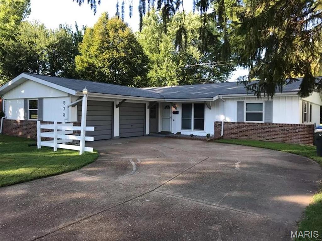Discover this charming 4-bedroom, 2-bath ranch home in the heart of Hazelwood, MO, offering 1,568 square feet of comfortable, single-level living. Step inside to a wonderful open floor plan perfect for entertaining, anchored by a beautifully updated kitchen featuring stylish grey cabinets, stainless steel appliances, and a spacious island with abundant counter and storage space. The generous master suite boasts two large closets and an updated full bath, while three additional bedrooms provide ample closet space and share a second updated full hall bath. Outside, enjoy a level backyard ideal for gatherings with friends and family, plus an oversized attached garage with room for two vehicles and extra storage. With thoughtful updates throughout, this move-in-ready home is a fantastic find for anyone seeking space, style, and convenience in a well-established Hazelwood neighborhood.