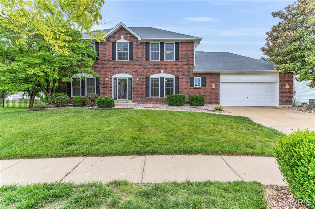 This is an incredible 2 story in the sought after neighborhood of Presidio.  The home features a full BRICK front, vinyl siding, enclosed soffits, black shutters, Stone patio, Firepit, professional landscaping and irrigation all on a beautiful third of acre lot.   Interior has over 2600 sq ft, 4 bedrooms, 2 full baths and 1 half bath, 2 car garage.  Main level has front dining room and study/den.  Open floorplan between the greatroom, breakfast room, and kitchen.  Main floor laundry.  Features include Hardwood floors, crown molding, kitchen center island and breakfast bar, Kitchen desk, double pantry, laundry room cabinets and cubbies, Large greatroom with woodburning fireplace, brick surround and hearth, built in bookcases.  Enjoy the Four season room which is heated and cooled separately.  Primary bedroom suite with luxury bath, dual sinks, step up jacuzzi tub, walkin closet, 3 additional generous size bedrooms.  Lower Level is ready for you finish.  Two new 40 gallon water heaters, Dual/Zoned HVAC, and so much space for finish, storage, and a workshop.  

Itemized List:
Inground sprinkler system
-VacuFlow inline vacuum system-basement, main floor, 2nd floor and garage
-Jacuzzi Whirlpool w/jets, dual head shower & body jets in masterbath
-Hardwood floors and ceramic tile on main floor
-Built in bookshelves either side of fireplace
-300 sqft sunroom with new (2026) HVAC system
-New windows, shutters and front door trim on front of house-2024 St. Louis Design & Build
-Oversized garage
-4 Person custom locker organization system and utility sink in laundry room
-North Star Reverse Osmosis Drinking Water System-kitchen
-Dual zoned HVAC system
-Finished patio with fire pit, water feature and LED dust to dawn exterior lighting
-Large center island in kitchen, black granite sink, solid surface countertops (Hi-Mac)
-Ceiling fans in every room
-9ft ceilings-main floor

Please note the Washer  & Dryer are 3 years old and will stay with the home.