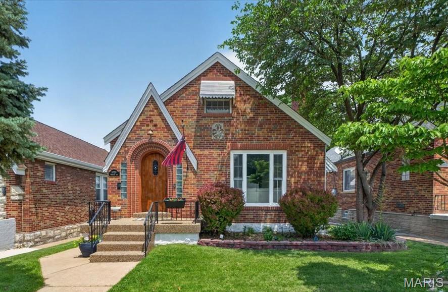 Welcome home to this surprisingly spacious gingerbread charmer in the heart of Northampton! Offering approximately 1,500 square feet, 3 bedrooms, and 2 full baths, this lovingly maintained home blends timeless St. Louis character with thoughtful modern updates. Inside, you'll find beautiful hardwood floors, classic arched doorways, and a decorative fireplace that adds warmth and charm to the living space. The kitchen opens to the family room, creating an inviting layout for everyday living and entertaining. Step outside and enjoy the aggregate front porch and patio, complete with illuminated patio stairs, mature dogwood, redbud, and apple trees, outdoor speakers with Bluetooth amplifier, and an enclosed storage shed beneath the back room. Whether you're hosting friends or enjoying a quiet evening outdoors, this backyard offers a wonderful extension of the living space. Major updates include a new roof (2021), new gutters (2019), patio stair lighting (2022), WiFi-enabled garage door opener (2025), and new countertops and carpet (2026). Zoned heating and cooling provide added comfort and efficiency throughout the home. The property also features a one-car garage and an unfinished basement with abundant storage space. Located on a quiet non-through street with wonderful neighbors, this home is perfectly positioned to enjoy all that Northampton has to offer. Walk to parks, schools, churches, grocery stores, coffee shops, restaurants, and neighborhood favorites. This is more than a house—it's an opportunity to enjoy the charm, convenience, and sense of community that make Northampton one of St. Louis' most beloved neighborhoods.