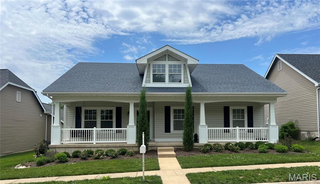 Welcome home to this beautifully maintained ranch nestled in the highly sought-after  WingHaven/Boardwalk Meadows community. Offering 3 bedrooms, 2 full baths and over 1,600 square feet of comfortable living space. From the moment you arrive, you'll be impressed by the inviting front porch with a cozy swing, perfect for morning coffee, and the manicured landscaping create exceptional curb appeal, while the open-concept floor plan provides the perfect setting for both everyday living and entertaining. The spacious living room features a cozy fireplace and abundant natural light, flowing seamlessly into the dining area and kitchen with stainless steel appliances, ample cabinetry, and a center island ideal for meal preparation, casual dining, or hosting guests. The private primary suite offers a relaxing retreat, complete with a spacious walk-in closet and an en-suite bath featuring dual vanities, soaking tub, and separate shower. Two additional bedrooms offer flexibility for family, guests, or a home office, while the convenient main-floor laundry room adds everyday functionality. Outside, enjoy a low-maintenance lifestyle with outdoor spaces perfect for evening relaxation, or entertaining. Conveniently located near WingHaven amenities, shopping, dining, entertainment, and quick access to Highway 40/64 and 364. This move-in-ready home delivers comfort, style, and an unbeatable location. Whether you're looking for your first home, downsizing without sacrificing comfort, or seeking a move-in-ready property in an exceptional location, 321 Hawks View Drive delivers the perfect combination of style, functionality, and community living. Don't miss this opportunity, schedule your private tour today.