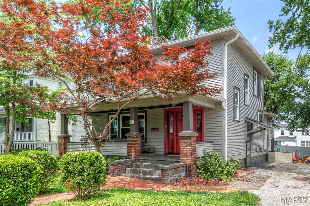 Built in 1922, this charming two-story home is situated on a picture perfect lot with a deep fenced-in backyard, spacious back deck, separate storage shed, one-car garage & covered porch with bead board ceiling. French doors lead to the large living room & separate dining room with vintage millwork & LVP flooring. Bright & cozy kitchen features stainless steel appliances & solid surface countertops. Upstairs find three good-sized bedrooms with LVP flooring & full bath with a unique skylight shower. The partially finished lower level features a full bath, rec-room, built-in bookcases, wood-burning fireplace, storage & separate laundry area. Numerous updates include exterior paint, full front door system replacement, window replacement on main level, leaf / gutter guards & new ceiling fans. All appliances remain including newer washer/dryer, refrigerator & chest freezer in lower level. Nestled in between two major highways, minutes to Lindenwood University, Blanchette Park, Main Street / Frontier Park & close to shopping & dining.
