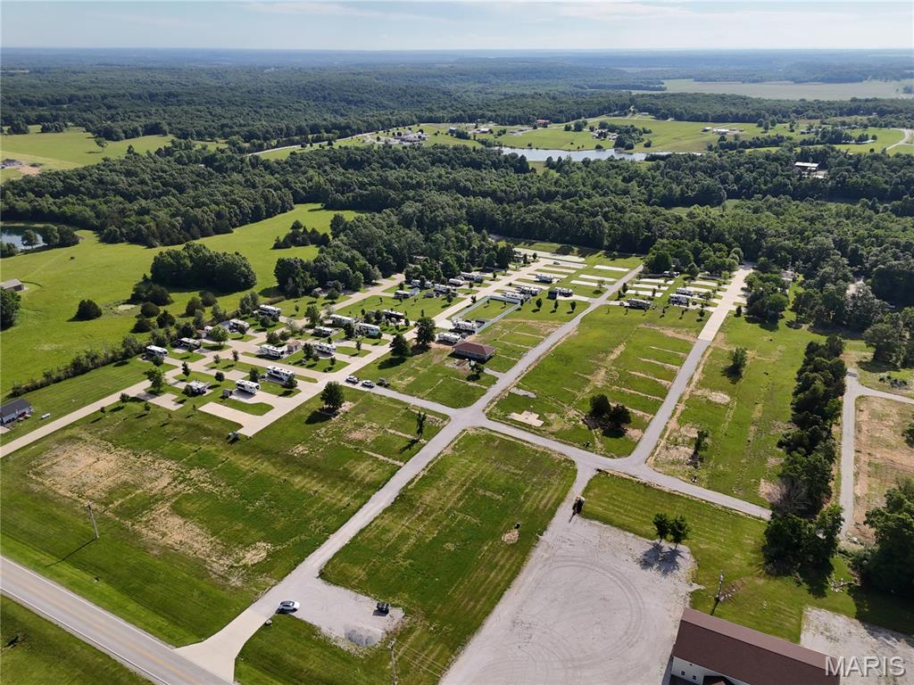 Discover your getaway spot at Adventure Out RV Park in Monroe City! Lot 45 is a 50x100 paved lot is ideal for your RV, offering plenty of room for setup, outdoor seating, and parking. With a paved surface, you’ll enjoy easy maintenance and convenience during your stays.
Adventure Out RV Park is open March through November, making it the perfect seasonal retreat near Mark Twain Lake. The park also provides maintenance services for your RV or camper right on-site. Enjoy fishing, boating, and all the local attractions just minutes away. Whether you’re looking for a weekend escape or a summer-long stay, this lot provides a comfortable, hassle-free base in a welcoming community. Seller Financing Available! Just 10% down with financing available for up to 180 months at 8% interest. Monthly payments start at approximately $480/month. Multiple lots are available in the campground!