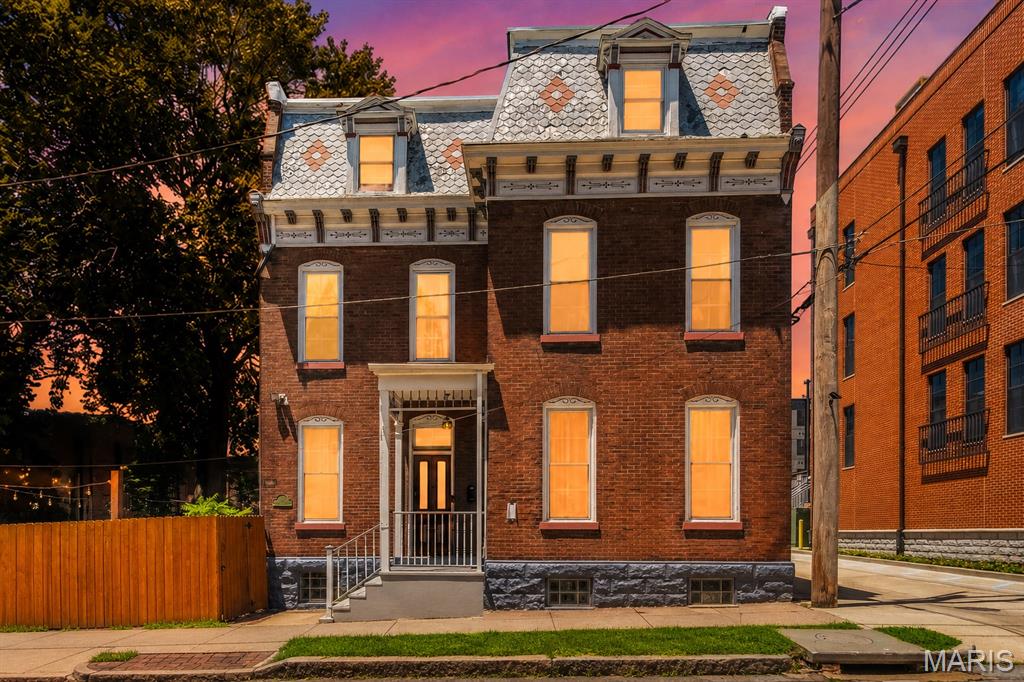 Open House Saturday, June 20th from 1:00–3:00 PM!
Nestled in the heart of historic Soulard, this charming 3 bedroom, 2.5 bath home offers nearly 3,000 square feet of character, craftsmanship, and modern updates. From the stunning interior and exterior trim work to the private backyard oasis, every corner of this home showcases details that must be seen to be fully appreciated.
The main level is designed for both everyday living and entertaining, featuring a spacious dining room highlighted by a decorative fireplace and intricate ceiling details, a large living room, convenient mudroom, and an updated kitchen complete with white cabinetry, exposed brick accents, and stainless steel appliances.
The second floor offers two generously sized bedrooms, additional exposed brick features, a convenient laundry area, and a full bath. The third floor provides incredible flexibility with a large recreation room featuring a bar area and wood flooring, a full bath, and a third bedroom perfect for guests, a home office, or additional living space.
Recent updates include a new roof and one of the home's three HVAC systems replaced in 2023. Ideally located within walking distance of Soulard's most popular restaurants, shops, and nightlife, this home is just steps from the iconic McGurk's. Enjoy the perfect blend of historic charm, modern conveniences, and an unbeatable location.