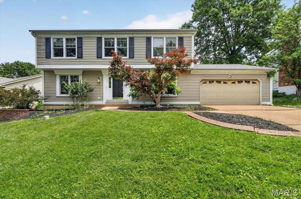 Welcome to 800 Bridlebrook Lane, a classic Colonial beautifully situated on a prime lot in the highly sought-after Briar Hills Farm subdivision. Enjoy the convenience of neighborhood amenities just across the street, including the community pool, tennis courts, and pickleball courts. This impressive 4-bedroom, 2.5-bath two-story home offers timeless style, generous living spaces, and a floor plan designed for both everyday living and entertaining. The main level features formal living and dining rooms, while the inviting family room is anchored by a stunning brick wood-burning fireplace and includes a wet bar and bay window overlooking the backyard. A spacious vaulted sunroom surrounded by windows provides breathtaking views of the private backyard oasis, complete with a pond, waterfall, patio, and lush landscaping. The main-floor laundry and mudroom add convenience, along with the oversized two-car garage. The luxurious primary suite offers a true retreat with custom built-ins, statuary marble floors and countertops, heated floors, a soaking tub, and a digital shower system featuring a rain shower and body sprays. All secondary bedrooms are generously sized with excellent closet space. The walk-out lower level provides additional living space with a recreation room. This exceptional home combines classic elegance with modern comfort. Located in the award-winning Kirkwood School District and one of the area's most desirable neighborhoods, it offers that rare combination of location, amenities, quality, and lifestyle. Don't miss your opportunity to call this Briar Hills Farm beauty home!