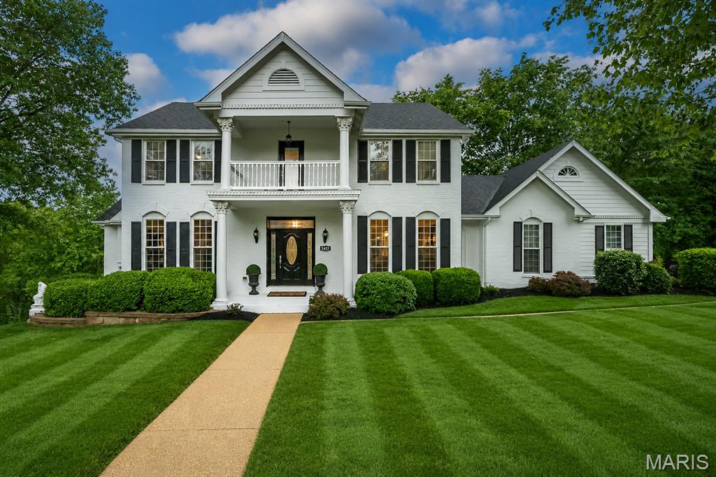 Beautifully updated home tucked away on a quiet cul-de-sac in the heart of Wildwood! Set on a picturesque .6-acre lot backing to trees and acres of common ground, this property offers peaceful views, privacy, and room to relax both inside and out. Warm hardwood floors, updated lighting, custom millwork, and inviting living spaces create a welcoming feel throughout. The stunning kitchen is the heart of the home with an oversized island, custom cabinetry, professional-style gas range with dual ovens and griddle, designer finishes, and plenty of space to gather with family and friends. Spacious family room with wood beams and stone fireplace, elegant dining room, and beautifully updated finishes throughout. Upstairs, the generous primary suite offers a relaxing retreat with spa-like bath features. Finished walk-out lower level includes a large rec room, game space, private office, and plenty of room for movie nights or entertaining. Expansive deck and patio overlook the wooded backyard and rolling common ground beyond. Roof 2 yrs, HVAC 4 yrs, WH 1 yr. Systems serviced bi-annually, month to month pest control. Beautifully landscaped yard is maintained by an inground sprinkler system.   Located in the highly rated Rockwood School District and just minutes from Wildwood parks, trails, playgrounds, and community amenities. Carefully updated (kitchen, baths, roof, systems, flooring, stairs, and more!) and cared for inside and out!