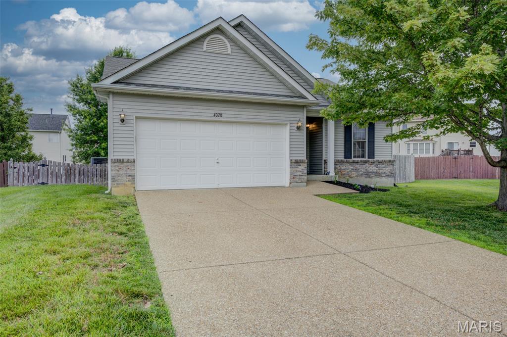 WOW BEAUTIFULLY UPDATE/UPGRADED home in sought after Stone Meadows Subdivision.  Look at the FANTASTIC kitchen w/Quartz counter, newer white soft close cabinets, stainless steel appliances w/5 burner gas stove but also 220 behind stove if Buyer prefers electric, subway tile backsplash, decorative display shelving, deep sink w/goose-neck faucet & canned lighting. Vaulted thru dining & living area w/cozy fireplace. Slider leads to the 20x16 composite deck built in '24 & privacy fenced level big yard. Updated main level hall bathroom. Primary suite w/walk-in closet, ceiling fan & private bath w/double sinks, shower, soaking tub & linen closet.  Secondary bedrms have overhead lighting & 1 w/fan & closet organizer. Main level laundry room w/cabinets. Open stairwell to newly finished lower level w/bar area w/soft closet cabinets that match the kitchen,  Granite counters, drink fridge & lux vinyl plank floors. Lower level is finished has great flow w/multiple social area, space for a pool table (negotiable), ping pong, dart board w/spotlight & floor throw-marking, tv viewing area & play area. Bathroom boasts a floating cabinet & lux vinyl plank floors. There is an office/guest room in the basement to add to your finished space.  2 rooms w/doors to accommodate your storage needs.  The furnace, AC, roof, water heater are all 10 years or less.  The home is freshly painted neutral & move in ready. The garage has a 220v outlet for charging an EV car or compressor.  Conveniently located on a quiet cul-de-sac. Subdivision has wonderful Amenities including clubhouse, 2 different pools, baseball fields, walking trails plus the elementary schools, middle and high school are all just a close drive down the subdivision boulevard.  This rare find won't last long, book your showings today!