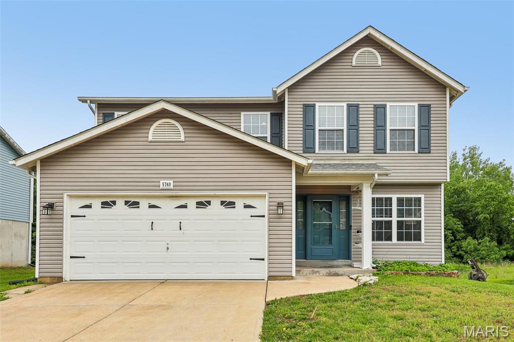 Welcome to this charming two-story home with three bedrooms and two and a half baths!   The main level features the kitchen which has a cozy shiplap-accented dine-in area, a corner pantry, and main-floor laundry. In the upper level you will find the primary suite features a vaulted ceiling, walk-in closet, and a fully renovated en-suite bath. The upstairs is rounded out with Two additional bedrooms as well as a bonus space perfect for your home office. The partially finished lower level includes a rough-in bath, egress window, and an electric fireplace. All levels of the home have low maintenance laminate flooring for versatility. With a brand-new water heater installed in the last 30 days, newer roof, some fresh paint, a vinyl-fenced backyard with a deck, and a two-car garage, this home is ready for you!  The HOA does include a pool and clubhouse.  This property is located close to Missouri Highway 30 for easy access to many different amenities.  Schedule your showing today!  INCLUSIONS:  KITCHEN REFRIGERATOR, UPHOLSTERED STORAGE BENCHES IN LOWER LEVEL AND TRAMPOLINE ALL AS-IS.