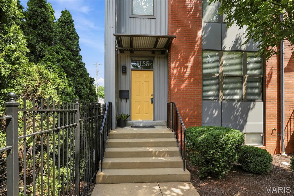 Welcome Home to this Newer Contemporary Style Townhome in the active Central West End Community.  Upon entering you will be greeted by beautiful wood floors in the living room as well as Family/Dining Room.  At the center of everything is the updated kitchen with newer appliances and Quartz countertops.  Half bath completes the main level.  Upstairs find a primary bedroom complete with cozy sitting nook Updated Ensuite bath has step in shower & Rain Showerhead.  2 additional bedrooms and additional bath round out the 2nd floor.  Walk out onto your private deck that leads you to your private 2 car garage and yard. Front yard has irrigation system.  Basement is a tall pour so could be finished.  Washer/Dryer/Refrigerator are included, are working, and is AS-IS.