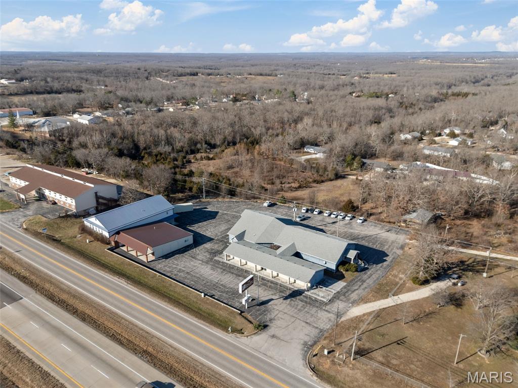 Expansive 20,000± SQ FT Compound with Prime Hwy Frontage

Position your business for success with this rare 20,000± sq ft multi-building property. Boasting premier highway frontage between Waynesville and the gates of Fort Leonard Wood, this location offers the high traffic counts and easy access your project demands.

Building A: 16,000± sq ft of well-maintained, open space.

Building B: 4,000± sq ft secondary facility.

Parking: Ample blacktop parking to accommodate large crowds or fleets.

Whether you are looking to establish a regional hub, a retail destination, or a specialized training facility, these clean, open-canvas buildings are meticulously kept and move-in ready. Don't miss out on one of the most versatile properties in the area.