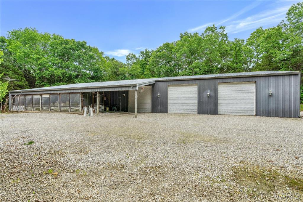 Showings start Sunday 7/12 during open house from 12-2. Welcome to your dream country retreat! This 3-bedroom, 2-bathroom barndominium offers the perfect blend of modern comfort, functionality, and peaceful acreage living. Situated on 3.54 acres, this property provides plenty of space, privacy, and endless possibilities. Step inside to find an inviting layout featuring spacious living areas and a warm rustic design. A true highlight of this property is the huge garage, providing incredible space for vehicles, hobbies, storage, a workshop, or all your outdoor equipment. There is also a The acreage offers room to roam, garden, enjoy nature, or create your own private oasis. Whether you’re looking for a peaceful homestead, a place to entertain, or simply more room to breathe, this barndominium delivers the lifestyle you’ve been searching for. Don’t miss the opportunity to make this unique property your own!