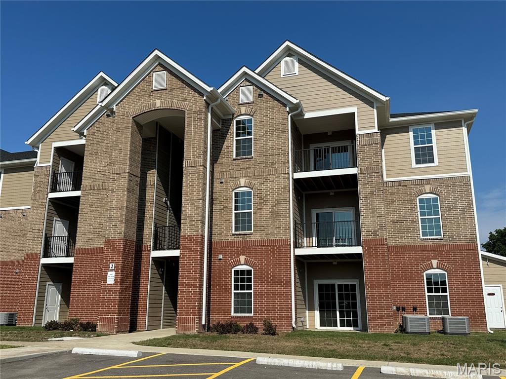 3rd floor unit.  Be one of the first to take advantage of this location and pricing... to live in a brand new home! Great opportunity to rent a brand new condo unit! Welcome to Harmony Meadows Apartment homes! The interior has the newest features such as 9 ft ceilings, canned lighting, double paned doors, contemporary fixtures and luxury vinyl plank flooring. Kitchen has a deep sink and high faucet, roomy 38" cabinets have cooking ventilation built-in and beautiful granite countertops, Whirlpool stainless steel electric range, dishwasher and refrigerator. Dining area is suitable for your friends and has a pantry for your convenience. The open great room has an electric fireplace for your comfort and a nice view outside the sliding doors to the composite balcony, where storage is also available. Large primary bedroom with ceiling fan has a ensuite with adult size vanity and a walk-in closet. The second bedroom has a ceiling fan as well with a full bathroom within steps of the bedroom door. A fabulous layout that can give two parties privacy and it's also equipped with a fire sprinkler system for your safety. Fantastic location. Minutes to WingHaven and Hwy 40/64 / Technology Dr. Close to Hwys 364, 40/64 and 70! Minutes to restaurants, shopping, and many amenities. Walk to Kinetic Park! Must see and compare to other area apartments and rentals. This is by-far the most for your money and it has never been lived-in!!