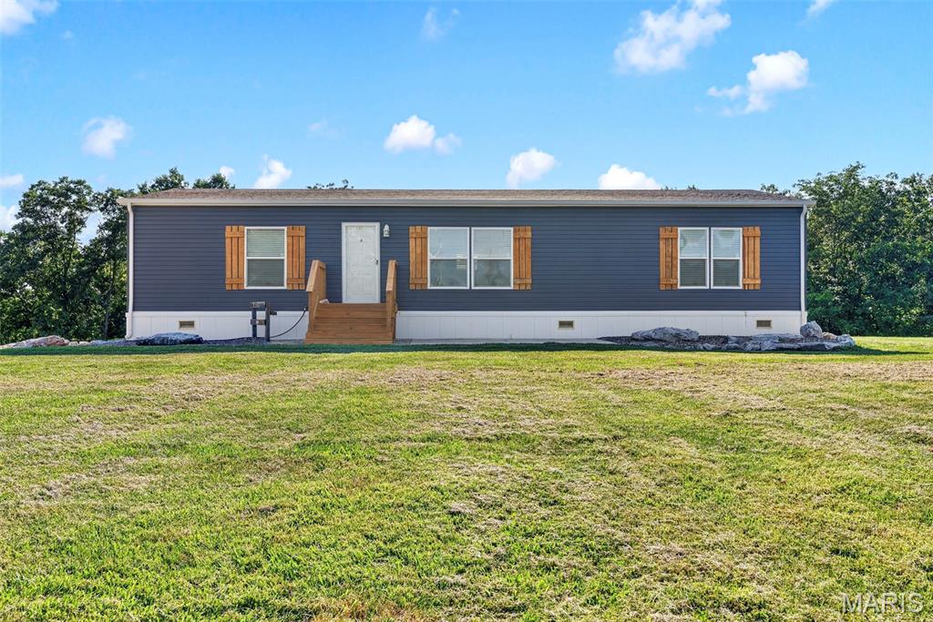 Welcome to 845 Hwy EE, where peaceful country living meets move-in-ready convenience! Situated on 2.76 beautiful acres, this well-maintained mobile home offers the perfect opportunity for those looking to enjoy extra space, privacy, and a rural setting while still being within easy reach of nearby amenities. The home is move-in ready, featuring a functional floor plan, comfortable living spaces, and plenty of natural light. Whether you're a first-time homebuyer, looking to downsize, or searching for an investment property, this home is ready for its next owner. Outside, you'll appreciate the expansive 2.76-acre lot, providing endless possibilities for gardening, recreation, outdoor entertaining, or simply enjoying the open space. Bring your pets, park your recreational vehicles, or create the outdoor retreat you've always envisioned.
Don't miss this affordable opportunity to own acreage with a move-in-ready home. Schedule your private showing today!