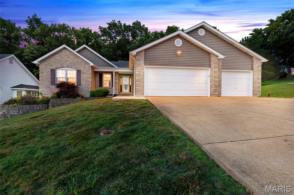 Rare 4 Bed/3 Bath ATRIUM RANCH offering over 3,400 finished sq ft in Windsor Schools with a welcoming foyer and a bright, airy open layout that instantly feels like home. This is the first ATRIUM RANCH on market in over a year in Windsor School District. Vaulted ceilings, rich walnut-toned luxury vinyl plank flooring, and newer carpet set the tone, while a dramatic wall of windows pours in natural light and frames the peaceful private wooded backyard. Enjoy a pond view across the street with bass and panfish, plus a nearby park setting—perfect for evening walks, relaxing, or a quick outdoor escape. The primary suite is tucked at the back of the home for added privacy, featuring serene backyard views, a huge walk-in closet, dual vanities, jacuzzi tub, and separate shower. The spacious kitchen offers ceramic tile, center island, tiled backsplash, large double-door pantry, built-in microwave, desk/coffee station, and abundant cabinetry. Convenient main floor laundry includes custom cabinetry and connects directly to the garage. The finished walkout lower level expands your lifestyle with a massive family room, gas fireplace, 4th bedroom/office, half bath, storage, and walkout to a large patio. Major updates include brand-new siding, new gutters, newer windows, French drains, and a 1-year-old roof. Nestled on a .33-acre lot in quiet Benzel Meadows with minimal traffic and mature trees. TRUE OVERSIZED 3-CAR GARAGE delivers exceptional space for your trucks, SUVs, storage and laslty a bump out area for your workbenches & large tool chest.