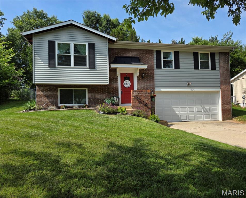 Come see this Adorable Fenton home located in desired Rockwood School District.  A Great opportunity in a Great Location near shopping, schools and major highway. The subdivision offers sidewalks and streetlights perfect for an evening stroll.  This home features 4 bedrooms generous in size and 2 full bathrooms with an oversized 2 car garage.  Other features are fresh paint throughout as well as beautiful hardwood flooring, a spacious dining room and kitchen island coffee bar having extra storage, a Newly Installed mounted microwave, lazy susan cabinet, as well as a kitchen pantry.   Just off the dining room is the backyard entrance just awaiting the new owners touch for a large patio or deck to make it your very own outdoor entertainment space in the Fully Fenced Back Yard.  The lower level 4th bedroom can also be turned into a second living room,  game room, office space OR guest room.  ** New Siding/Shutters 2017, New Windows Throughout 2017, Kitchen Cabinets and Granite Island new in 2017, L/L Ceramic Shower New in 2017, New 6 Panel Doors and Trim 2026, New Main Level Bath dual sink vanity 2024.  Call to get your appointment booked TODAY!!