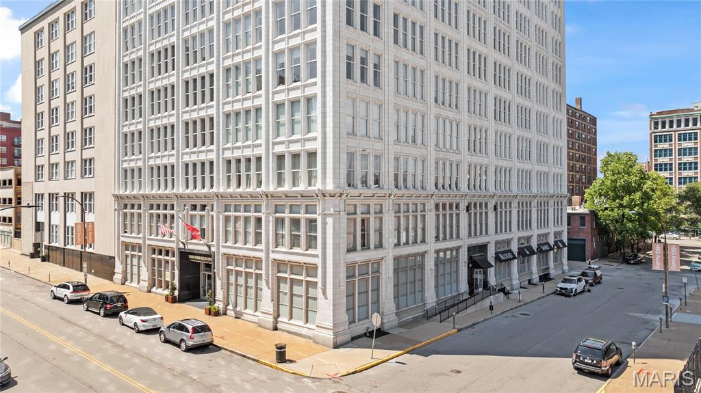 Welcome home to Unit 609 at the historic Terra Cotta Lofts, where a century of St. Louis story meets effortless downtown living. Built in 1917 at the height of the city's commercial golden age, this 12-story Beaux-Arts landmark earned its name from the ornate terra cotta detailing that still crowns its facade today. Step off the elevator and into a loft that honors that legacy with soaring ceilings, oversized windows, and authentic urban character at every turn.

Inside, this 2 bedroom, 2 bath loft offers 1,557 square feet of light-filled living, a rare amount of space at this address. The open floor plan flows from the kitchen into a generous living area framed by huge windows, giving you room to entertain, work from home, and truly spread out. Two full baths and dual bedrooms make the layout work equally well for owners, guests, or a dedicated office. Residents enjoy secure entry, a welcoming lobby, a second-floor community room, rooftop access with skyline views, and garage parking and storage available in the building.

The location delivers the complete downtown lifestyle. One block north, the Washington Avenue corridor is in the middle of an exciting renaissance, with neighborhood favorites like Sugarfire Smoke House, Rooster, and Sauce on the Side just steps away. Walk to City Museum, catch a Blues game at Enterprise Center, a CITY SC match at Energizer Park, or a show at the Stifel Theatre. Union Station, the St. Louis Wheel, Ballpark Village, and Busch Stadium round out a true walk-to-everything address.

Daily life is just as easy. Schnucks Downtown handles full grocery runs a short walk away, and City Foundry with its food hall, Fresh Thyme market, and Alamo Drafthouse is five minutes west. Commuters will love this spot: the Civic Center MetroLink station and transit center is within walking distance with direct rail service to the airport, Clayton, and the Central West End, while I-64, I-44, I-55, and I-70 all converge minutes from the building. Lambert International is about 20 minutes door to door.

Whether you are a first-time buyer, a professional seeking a vibrant urban lifestyle, or an investor looking for a piece of historic downtown with real momentum behind it, Unit 609 checks every box. At 1,557 square feet, lofts with this much space, character, and convenience do not wait around. Schedule your private showing today and experience the Terra Cotta difference for yourself.