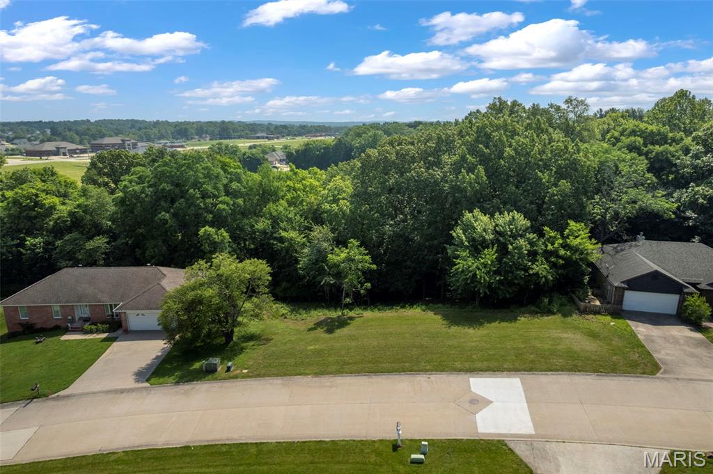 Build your dream home in desirable Hickory Lane Estates! This 0.42± acre residential lot is located in an established subdivision and offers a beautiful setting with mature woods to the rear. The gently sloping terrain provides an excellent opportunity for a walk-out basement design while creating the perfect backdrop for a spacious deck or outdoor entertaining area overlooking nature. Zoned R-II and conveniently located near city amenities, this lot combines the benefits of neighborhood living with a private, scenic setting.