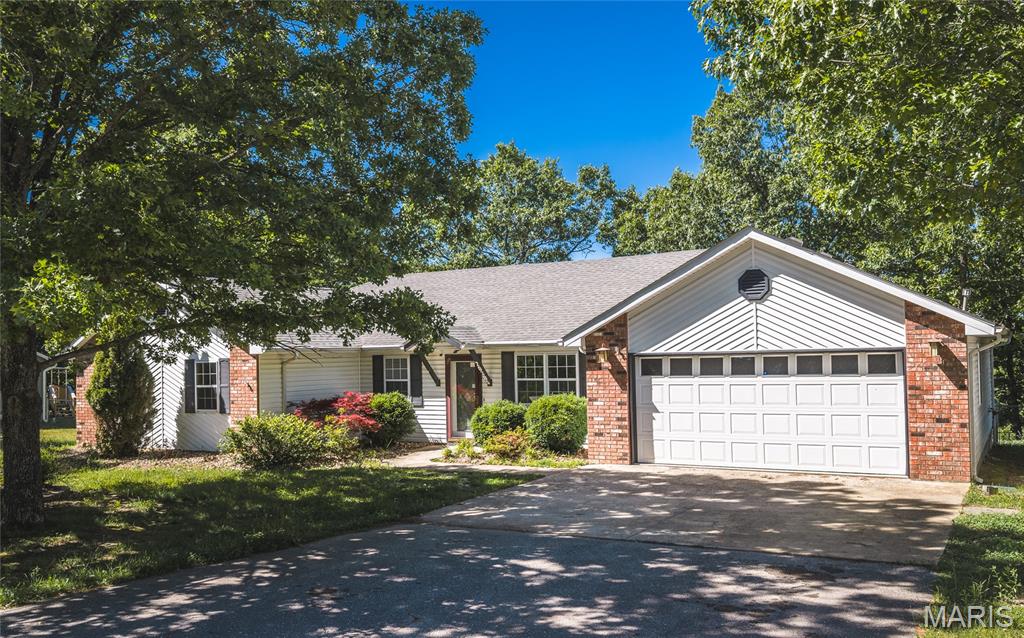 Nestled in a desirable subdivision just minutes from St. Robert, this beautifully maintained 5-bedroom, 2-bath home offers the perfect blend of comfort, style, and space both inside and out. Sitting on over an acre of land with mature trees providing shade and privacy, this property delivers the peaceful setting buyers are searching for while still being close to shopping, dining, schools, and Fort Leonard Wood.

Step inside and immediately feel at home with the inviting open floorplan designed for both everyday living and entertaining. Luxury vinyl plank flooring flows throughout the main living spaces, creating a warm and modern feel, while ceramic tile in the kitchen and bathrooms adds durability and timeless appeal. The spacious kitchen is truly the heart of the home, featuring granite countertops, abundant prep space, and room for gathering with family and friends.

Outside, the oversized deck overlooks a fully fenced backyard that’s ready for summer cookouts, pets, playtime, or simply relaxing under the shade trees. The large shed offers additional storage space for tools, hobbies, or outdoor equipment, making this property as functional as it is beautiful.

With exceptional curb appeal, generous living space, and a sought-after location near St. Robert, this home checks all the boxes. Schedule your private showing today and experience everything this incredible property has to offer!