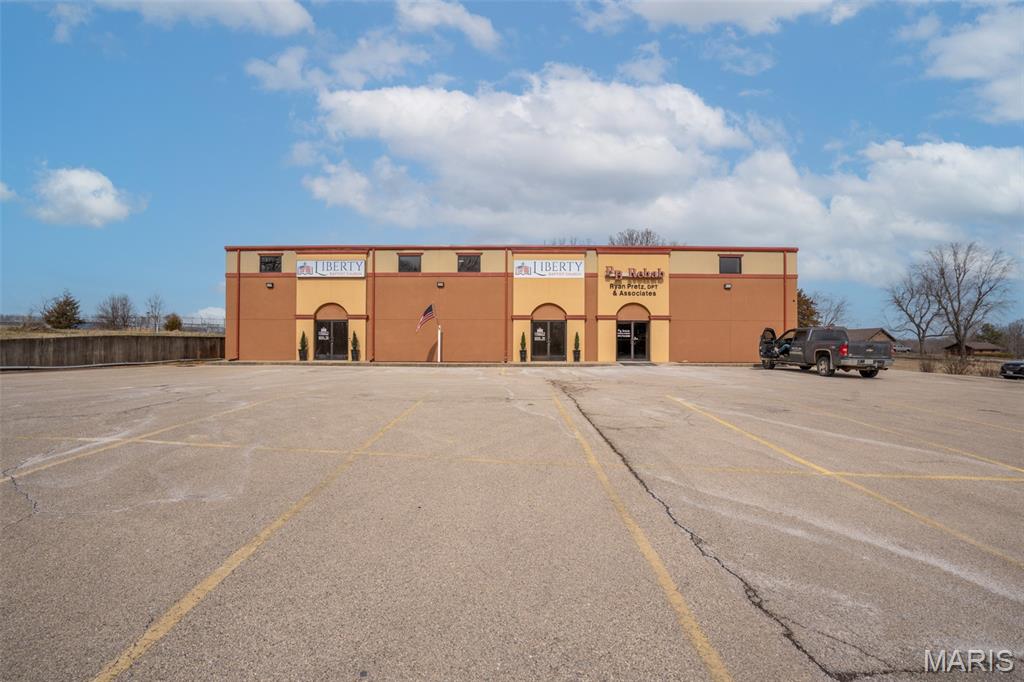 Prime commercial location with potential for multiple business opportunities! With having 4 tenants renting out the building, that brings in $9,950 in rent. In the old rehab facility, there is an in-ground pool. The upper level offers a large storage area. Sitting on .71 acre +/- this has paved parking on front and side of the building. This is a wonderful location with high traffic visibility. Endless possibility with this location so check it out for your business venture!