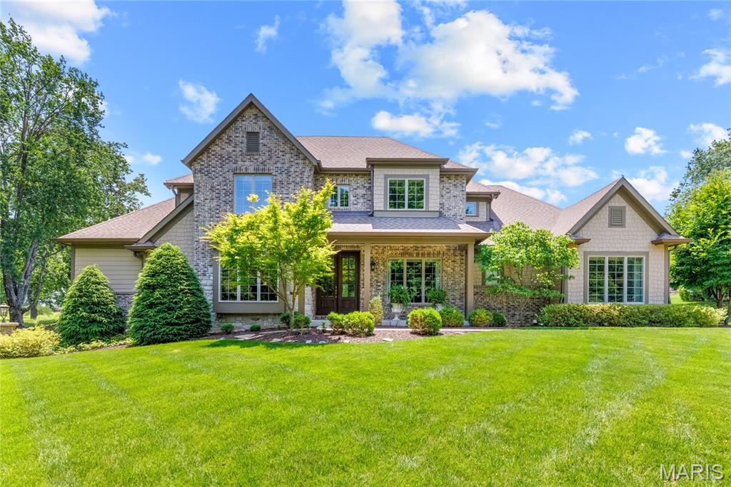 Located in prestigious Meadowbrook Country Club, this spectacular brick & stone 1.5 Sty from award-winning Flower Homes blends classic architecture with carefully curated details for a refined living experience. Distinctive design elements include soaring ceilings, wide plank maple hardwoods, graceful arched passageways & expansive windows that offer continuous vista views throughout the home’s interior. Wide porch entrance with extraordinary 8’ front door with beveled glass panes opens to impressive foyer, private study and elegant dining room. A beamed cathedral ceiling, floor-to-ceiling stone fireplace & expansive bank of windows set the tone for the stunning great room. Culinary enthusiasts will love the designer kitchen with 42” white cabinetry, granite countertops, commercial grade appliances & 8’ center island. The adjoining breakfast room opens to a light-filled sun porch providing a relaxing retreat. The coffered primary bedroom suite with full-height windows, 2 customized walk-in closets & luxury bath with soaking tub plus a second ensuite bedroom complete the main floor living quarters. Wide oak staircase accesses 2 additional ensuite bedrooms & loft sitting area. Situated on a parklike 1+ acre lot, the outdoor setting is equally inviting with professional landscaping & spacious patio for outdoor entertaining. Meadowbrook offers a golf community lifestyle with access to clubhouse, championship golf course, pool & tennis courts.
