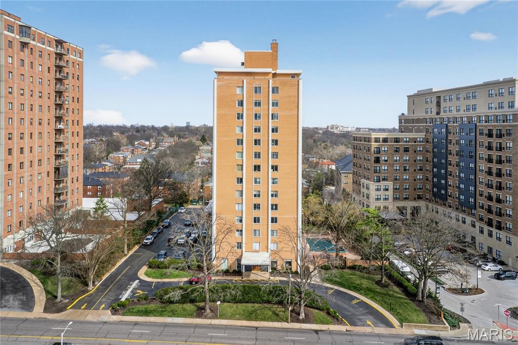 Don't miss this great opportunity to purchase this updated 2000+ sq. ft, 2bedroom, 2.5 bath condo in a wonderful centrally located full service high rise building in Clayton with lovely views to the north and east. Enjoy comfortable living and easy entertaining with the bright and sunny open living/dining room floor plan and updated kitchen with granite countertops and breakfast bar. Either of the two large bedroom suites, one at each end of the unit, could be used as the primary both with private baths and walk in closets.  The third bedroom is currently being used as a den or office, has built in bookcases and cabinets.  In unit laundry.  Parquet flooring throughout except for kitchen which is luxury vinyl.  Amenities to the building include 24 hour doorman, library and common area, underground parking with security guard, work out room, dog park, BBQ area and lovely outdoor pool.