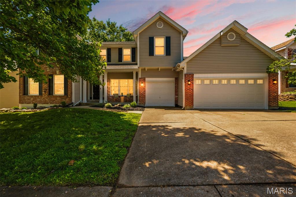 Welcome to this beautifully updated 2-story former display home, ideally situated on a quiet cul-de-sac within the award-winning Rockwood School District. With thoughtful updates throughout, this home offers a perfect blend of style, space, and everyday functionality.

This spacious home features 4 bedrooms, 3.5 baths, and an additional sleeping room in the walkout basement, providing flexibility for guests, work-from-home needs, or additional living space. The main level showcases luxury vinyl plank flooring, a sunken living room filled with natural light, and a warm, inviting family room complete with a wood burning brick fireplace and wet bar—ideal for both relaxing and entertaining.

The kitchen is a true standout, beautifully redesigned with quartz countertops, a large island with seating, high-end gas cooktop, and premium Thermador double wall ovens. It opens seamlessly to the breakfast room and hearth room, creating a natural gathering space enhanced by abundant light. A private dining room with French doors offers the perfect setting for more formal occasions, while main floor laundry adds everyday convenience.

Upstairs, all bedrooms have been updated with fresh finishes and new carpet. The primary suite offers a true retreat with vaulted ceilings, double door entry, and a spacious en suite featuring a modern dual-faucet sink design, soaking tub, separate shower, linen storage, and multiple walk-in closets. One secondary bedroom is currently configured as a dedicated laundry space with sink, offering flexibility and easy conversion back to a bedroom if desired.

The walkout lower level expands your living space with a large rec room, kitchenette, sleeping area, and a walk in climate-controlled wine cellar with an added humidor—perfect for entertaining or unwinding.

Step outside to enjoy a beautifully landscaped lot with mature trees, an aggregate patio and walkway, and a charming pond feature that brings a soothing and unexpected element to the outdoor space. The expansive deck with dual access points creates an ideal setting for gatherings or quiet evenings.

The 3-car garage provides ample storage and functionality. Located in the Harbors at Lake Chesterfield, residents enjoy access to a neighborhood pool, clubhouse, walking trails, multiple lakes, and many other perks. This established community remains a top choice for buyers seeking amenities, setting, and long-term value.