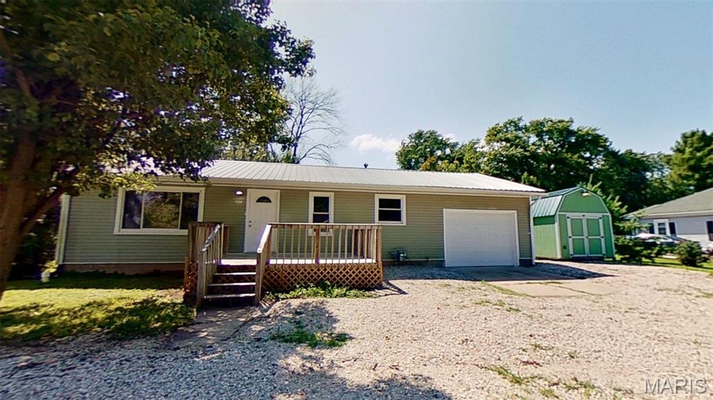 Beautifully renovated 2 bedroom home with bonus workshop/outbuilding.  This home offers affordable living with easy access to Hwy 54 & I-70, less than 1/2 hour from Columbia and Jefferson City.  The kitchen is spacious and bright with brand new stainless steel appliances, cabinetry & countertops.  This one sparkles with brand new flooring and paint throughout and low-maintenance steel roofing.  The one-car attached garage even has new paint.  The back yard has privacy fencing and a large deck to enjoy your slice of heaven in peace.  Need a workspace or extra storage?  Here you'll find a 15'x9' insulated outbuilding with 60 amp electrical service.  Schedule your private showing today!