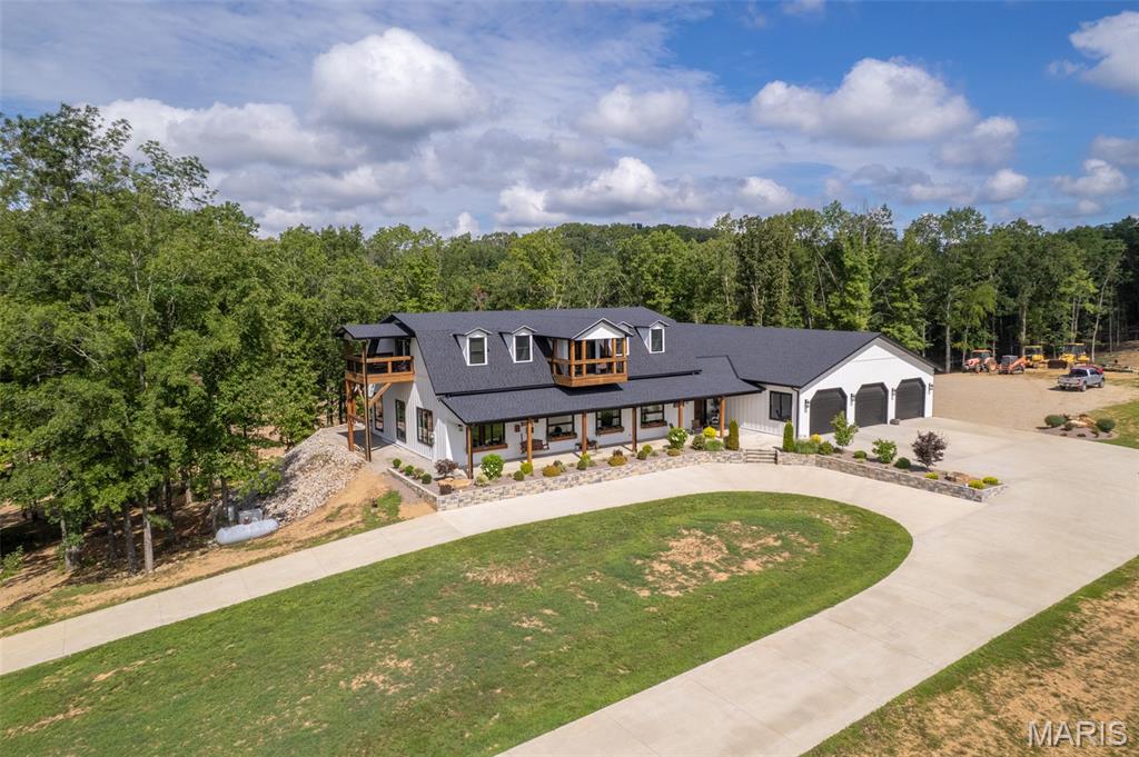 835 Monday Lane is an absolute stunning property.  This home has 4520 SF of living space and a 3500 SF attached garage/workshop for a total of over 8000 SF under roof.  This magnificent home was built by Integrity Design, one of the premier, custom home builders in the area.  Featuring 5 bedrooms and 4.5 baths, high ceilings, high end finishes and the best location in Butler County make this a must see if you are in the market for not just a home but an Estate to build your family's legacy.  Opportunities to purchase this kind of property don't come along very often.  The craftsmanship and attention to detail that went into building this home are second to none.  This home is being offered with 150 +/- acres of picturesque land.  Buyer will also have the choice of purchasing the home with 10 +/- acres.  Seller will provide survey depending on acreage agreed upon.  The maintenance free exterior, Generac, whole home generator, long, paved driveway, circle drive, massive, concrete parking area, covered front porch, covered back patio and really cool twin balconies put this home "over the top".  The living space is very impressive and then you walk into the garage and just go "WOW".  Schedule your appointment for a personal tour today.  It could change your life in a very positive way!