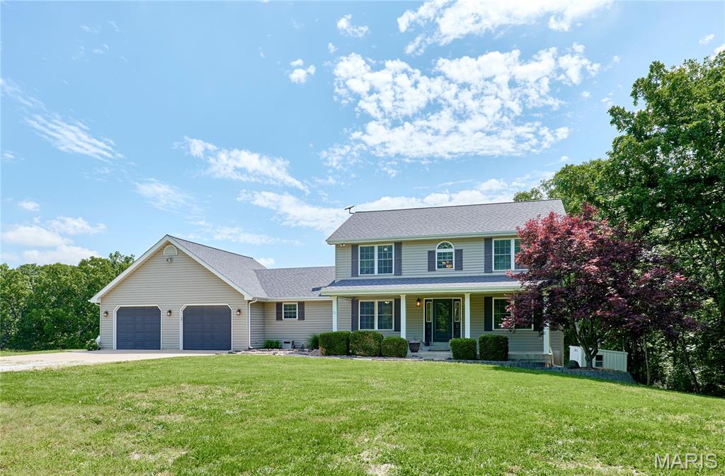 LOCATION, LOCATION, LOCATION!!! Every day coming home is a “walk-in-the-park” as this 6-bedroom 4-bathroom family home is located within and surrounded by Cuivre River State Park, minutes from highway 61!!! This 1.3 acre tract with NO RESTRICTIONS allows you space and freedom without the hassle of mowing and maintaining a larger parcel!!! Tons of space to spread out in this large and well-built, 2-story home with a main-floor primary bedroom, newer roof, fresh paint, solid-core interior doors, and updates throughout including newly customized closets in all 4 upper bedrooms and in the primary bedroom. Large enclosed main-floor laundry room with sink and cabinetry that has plenty of space to work. The kitchen is set up well for everyday cooking and the breakfast bar configuration makes entertaining a breeze!!! ALL appliances are included!!! Two-story entry foyer to the 4 bedrooms on the upper level creates volume when you enter the home and offers many decorating scenarios. The lower level is a walk-out, finished with a 6th bedroom, 4th full bathroom, office, family room, 2 storage rooms, and an 8 x 30 safe room/storm shelter/gun vault. The massive 28 x 30 garage is insulated, painted, and finished with custom shelving and a brand-new pull-down ladder leading to the attic storage area above. Geothermal heating and cooling as well as LP gas, public sewer, Cuivre River Electric, and a 625 ft deep well. Outdoor living like none other with 2 COVERED PORCHES,  20 x 30 patio, 12 x 34 wood deck overlooking the property, ginormous custom children’s playground and gazebo!!! The established landscaping, seamless mix of utilities, and huge house overall make this the picture-perfect place to call home. Don’t miss out on this one!!! Showings start on Monday, 6/1.