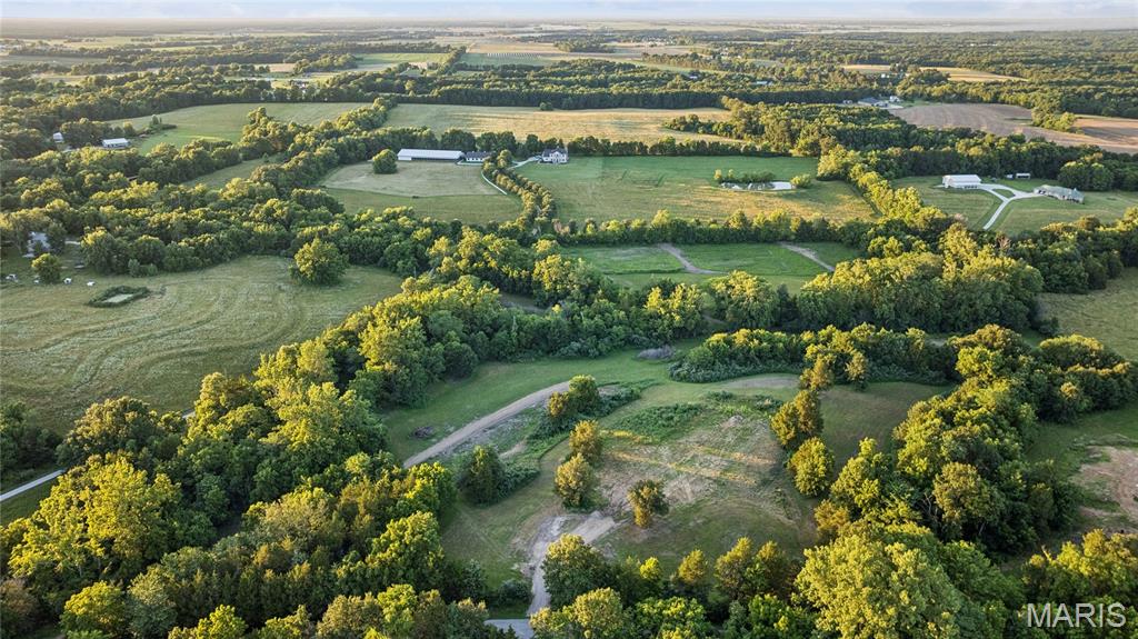 Escape to your own slice of Warren County. Roughly 5–7 acres of mature trees, natural beauty, and abundant wildlife. -The kind of quiet that's getting harder to find.
This is room to breathe. Room to build. And the groundwork is already done for you: enjoy road frontage with private access off Lix Road, utilities available at the property, and a build site that's already cleared and ready for your foundation. Picture your dream home tucked into the trees, a recreational retreat for weekends, or the hobby farm you've always talked about. -No waiting, no guesswork, just bring your plans.
Best of all, you don't trade convenience for seclusion. You're wrapped in privacy yet just four minutes to I-70 and only minutes from Warrenton's shops, schools, and everyday essentials. Wake up to birdsong and wide-open sky, then be on the highway before your coffee cools.
Land that's this private, this manageable, and already prepped to build doesn't sit long. Come walk it — and start imagining what's possible. For buyers seeking additional acreage, the seller is also offering the full 22-acre tract (MLS#26038812) or the 15-acre tract (MLS#26038862) for purchase. Check out the additional MLS listings available.