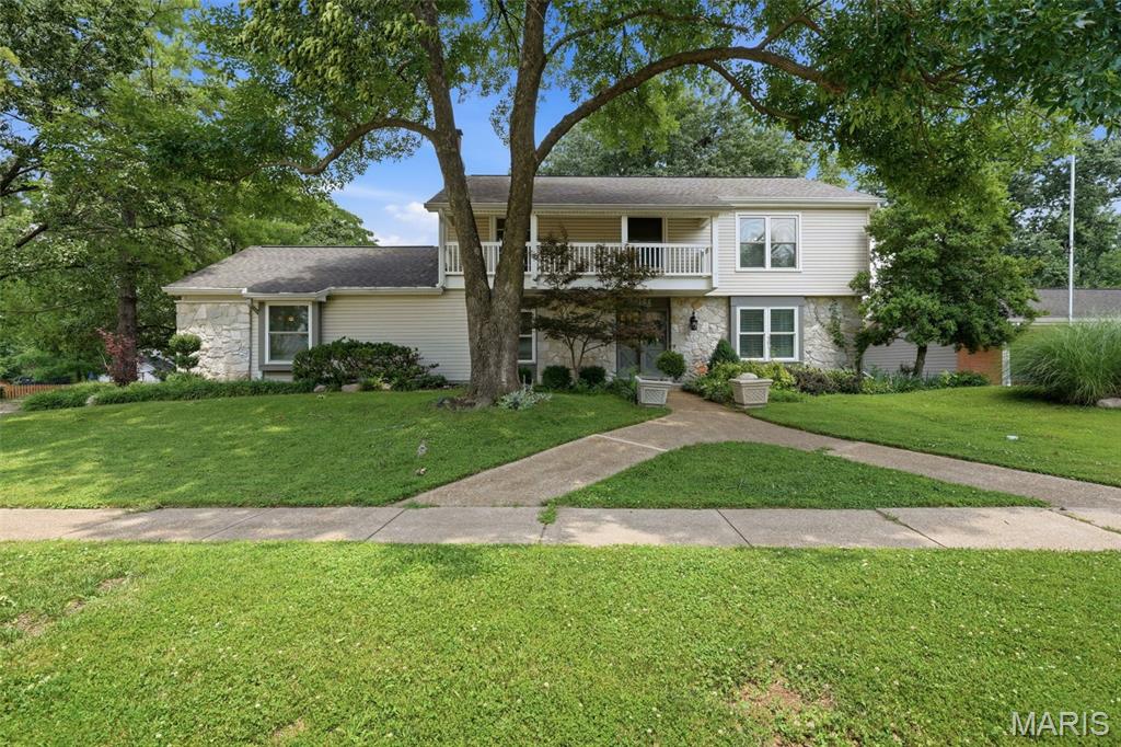 Welcome to a truly exceptional Chesterfield residence where timeless elegance meets modern comfort. Perfectly positioned on a beautifully landscaped Corner lot, this impressive home offers the space, style, and functionality today's buyers are searching for. From the moment you step into the welcoming foyer, you'll appreciate the generous living spaces, exceptional layout, and quality improvements throughout.
Extensively updated, this impressive 4-bedroom, 3-bath home features a remodeled kitchen, beautifully renovated bathrooms, updated flooring, fresh paint, and an HVAC system replaced in 2022, offering peace of mind and move-in-ready convenience.
Designed with entertaining in mind, the expansive floor plan offers multiple gathering spaces to suit every occasion. The oversized family room is a true centerpiece, featuring a cozy fireplace, abundant storage, and direct access to a private side patio. A charming hearth room shares the fireplace, creating an inviting atmosphere for relaxing evenings. The formal living room showcases beautiful wood flooring and flows seamlessly into the elegant dining room, complete with custom built-in cabinetry for added style and functionality.
The spacious kitchen is a dream for home chefs, offering abundant counter space, two pantries, and easy access to the backyard through a sliding glass door. Step outside to your own private retreat featuring a fully fenced yard, expansive patio, mature landscaping, including custom landscape lighting that creates a stunning evening ambiance.
Upstairs, you'll find the Primary suite and three generously sized secondary bedrooms along with a luxurious primary suite featuring a walk-in closet and a beautifully renovated spa-inspired bath. One secondary bedroom offers its own private balcony, the perfect place to enjoy morning coffee or peaceful evening breezes overlooking the beautifully landscaped yard.
The partially finished lower level provides incredible flexibility with abundant storage and endless possibilities for a recreation room, home gym, media space, workshop, or future expansion. A convenient mud room adds everyday functionality to this already impressive home.
Ideally located in the heart of Chesterfield, this exceptional property offers easy access to premier shopping, dining, parks, major highways, and award-winning Parkway schools. Combining the neighborhood's largest floor plan, extensive updates, outstanding outdoor living, and an unbeatable location, this is a rare opportunity to own a truly special home.