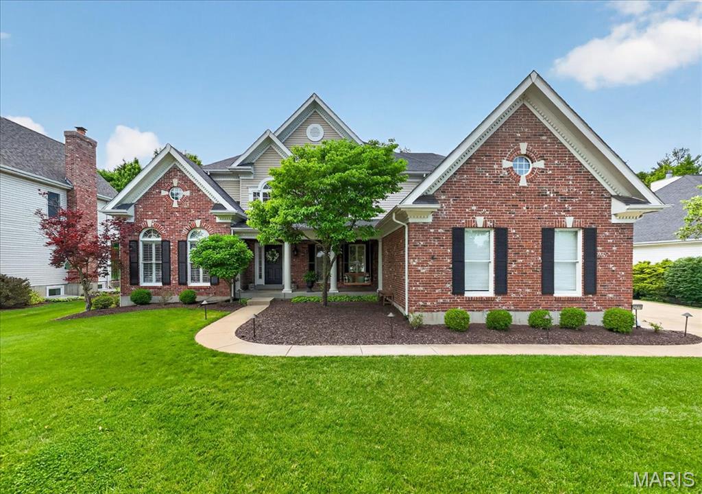 CANCELLED OPEN SUN 6/7 PROPERTY UNDER CONTRACT High quality luxury home in the middle of Des Peres, is 5-bedroom, 4.5-bath, and thoughtfully designed with large open areas.  Be greeted by the lush,level lawn, oversized flower beds, and charming front covered porch with swing, that puts you at ease.  Be amazed as you enter a dramatic two-story foyer with tall windows and a solid oak stairwell. In the expansive eat-in kitchen, you find the heart of the home, with custom cabinets, a large center island, solid countertops, Bosch stainless-steel appliances, an induction stove, a huge walk-in pantry, and a coffee bar. The hearth room is filled with natural light from the custom windows, has vaulted ceilings, a gas fireplace, built-in shelving, and creates an amazing open concept with the kitchen and breakfast area, as well as the private stone patio, great for the BBQ or outdoor dining, and yard big enough for the swing set. The dining room feels elegant, with wainscotting and a lovely chandelier. The living room has soaring ceilings, huge windows, and a second gas fireplace for perfect entertaining flow. The main level also features a generous primary suite with coffered ceilings, dual walk-in closets, and a luxurious bath with an oversized soaking tub, a large shower with a bench, dual vanity sinks, and a private commode. The main level also has a large executive office, a cheery laundry/mudroom off the side garage entry, and a guest half bath. Upstairs, find three large bedrooms, one en suite, the others connected by a beautiful Jack-and-Jill bath with dual vanities, and a bridge that overlooks the incredible   great room and both stairwells. The finished lower level seems endless and features a luxurious wet bar with an undermount sink, a granite bar top, and a wine and beverage fridge that opens to a huge living area. Additionally, a fifth guest bedroom suite with a full bath, another recreation area with an adorable, tucked-away life-size dollhouse, a sports training/workout area, and an abundance of storage make this basement the end-all, be-all. That, combined with the incredible ceiling heights of the main level, gives this home a very large, open, airy footprint. Plantation shutters and hardwood floors are just a few of the home's timeless touches. The home also has newer zoned heating and cooling, a sprinkler system, a sump pump and pit, and a huge driveway with room for guest parking. The garage is drywalled, with storage cabinets. This home is ready for those who love to host holidays and events, for cozy nights by the fire, or perhaps for those who could use a little breathing room. Situated in sunny Des Peres with great access to 270 and Manchester Rd., this upscale neighborhood is within the Westchester Elementary School boundaries of the Kirkwood School District. This home offers the most in its class for size, updates, and location.
