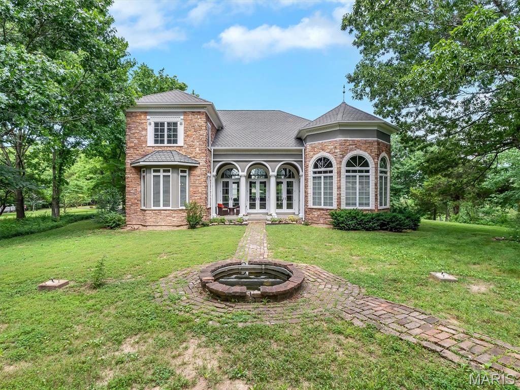 This is a unique MUST SEE property! The craftsmanship and detail in this custom built home are truly amazing with over 3.5 acres of flat usable land. This home features massive arched Anderson windows and almost 20 foot ceilings with 2' wide beams and massive internal pillars, 14' Jeldwen transom doors, imported mosaic tiles, wood inlay and crown mold everywhere. Master Bedroom Suite features double tray ceiling, double vanity, and double doors to courtyard. Custom Hood sets off the cook's kitchen with granite, walk-in pantry, Center Island and is adjacent to Great Room, Dining Room, & Sitting area with access to portico & garage. This estate is an entertainers dream and is great for hosting large events. The upper deck above the portico allows for amazing sunset & sunrise views.  The amount of natural light that fills every room with an abundance of windows to view the beautiful gardens and park like grounds. Above the garage is 400+ sq ft of bonus space that could be converted to in-law quarters.  So many possibilities with this property, it could be transformed and modified into a multi-generational compound.  Lots of garden areas and fruit trees abound. This property would be suitable for horses, cows, and chickens.  Black top parking area for a 40Ft motor home/travel trailer and a massive garage, extra deep with tall doors and ceiling, definitely perfect for the man cave with recessed lighting and finished throughout. Newest features on exterior - LP Smart Side, added 6" down spouts, deck rails, and some new 6" gutters where also added. Interior freshly painted throughout with Sherwin Williams.  Convenient to I-44 while still being very private and quiet. 8 minute drive to Birch Creek Golf Club designed by Former PGA Tour player - Randy Wolff.  5 minutes from the house is where the Meramec and Bourbese River come together with boat launch access and trails. 3 miles down the road is the River Round Conservation area with 330 acres that has river frontage, sandbars, upland, bottomland, forest, and fields that is great for hiking, fishing, and hunting.  Facilities include parking and boat ramp. Don't miss this opportunity to purchase a true one-of-a-kind home with so much to offer.