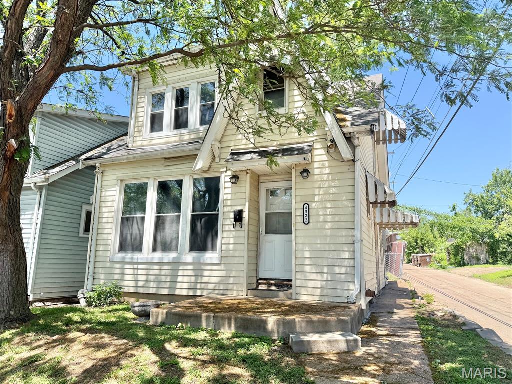 Great investment opportunity on this charming 2-story home full of character and potential! This 2-bedroom, 1-bath property features a spacious living room with beautiful stained-glass window overlooking stairs and classic arched doorways that add timeless charm. The main level also includes a dining room and  kitchen with plenty of opportunity for redesign and customization.  Upstairs offers two bedrooms and a full bath, while the unfinished lower level provides additional storage or future possibilities. Outside, enjoy a fenced backyard with potential for off-street parking.  With the right vision and updates, this property could be transformed into a great rental, flip, or owner-occupied home. Bring your ideas and make this one shine again!