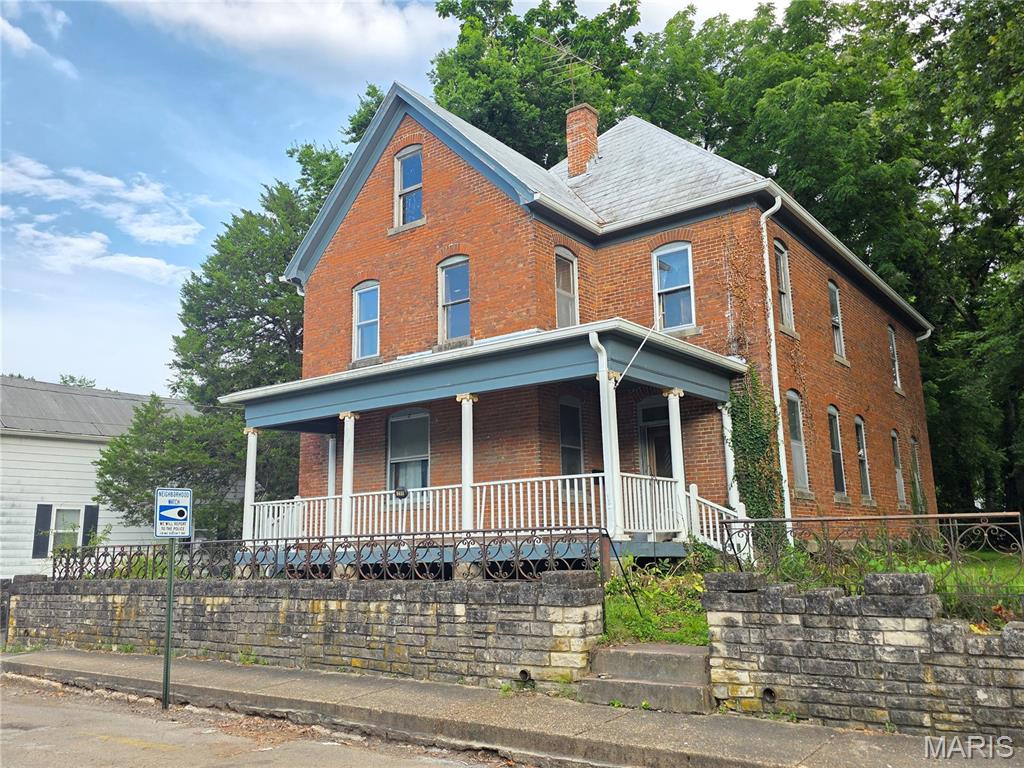 Historical magnificence in this 1903 built 2-story all brick home near the heart of Ste Genevieve of the historic district. This well-preserved classic home is a 6 bedroom, 2 bath home with over 2900 sqft of charm. There are some dated features and some updates needed but everything to make this into a true showcase home is there! Opportunity is knocking! This home offers the chance to build equity quickly while creating a space that reflects your style. If you're looking for an affordable property with huge potential, this could be the perfect place to make your vision a reality.