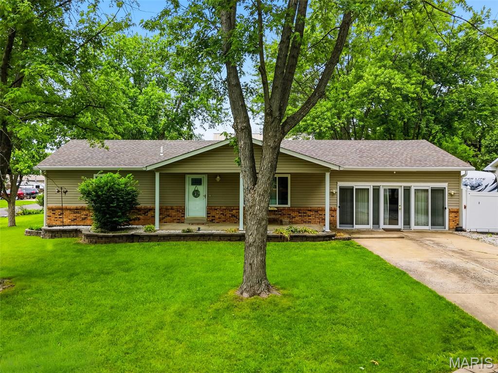 Charming 3-bedroom, 2-bath ranch home located in desirable O’Fallon, offering a perfect blend of comfort, functionality, and outdoor appeal. This well-maintained property features a spacious layout ideal for everyday living. Step outside to enjoy the covered deck complete with lighting—perfect for relaxing evenings or entertaining guests—along with added storage space for convenience. The yard is beautifully accented with mature shade trees and established flower beds, creating a peaceful, park-like setting. A standout feature is the impressive detached 2-story garage, fully heated and all electric with 200-amp service, providing ample space for a workshop, hobby area, or additional storage. The property also includes a RV or boat parking pad, offering flexibility for outdoor enthusiasts. This home combines practical amenities with inviting outdoor spaces—ready to fit a variety of lifestyles!