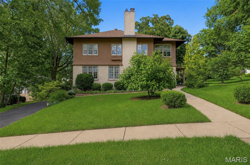 For the first time in generations, this extraordinary Webster Groves home is ready to welcome its next chapter.
Built in 1917 and lovingly held within the same family ever since, 445 Algonquin Place is a rare offering where history, craftsmanship, and thoughtful modernization come together seamlessly. The most recent steward of the home undertook the privilege of updating its systems while preserving the architectural details that make homes of this era so special.
Throughout the home, you'll find beautifully preserved woodwork, original built-ins, and intricate trim that speak to a level of craftsmanship seldom found today. Behind the scenes, major improvements to the electrical, plumbing, kitchen, and bathrooms provide the comfort and convenience expected for modern living.

With 4 bedrooms and 3.5 bathrooms, the floor plan offers flexibility for a variety of lifestyles. A main-level bedroom with an ensuite bath creates an ideal guest suite, private office, or multigenerational living arrangement. Upstairs, the primary suite is joined by two additional bedrooms and another full bath.

The nearly finished third-floor attic offers endless possibilities; whether envisioned as a playroom, home office, fitness space, studio, or retreat. Below, a rare tandem two-car garage provides convenient parking and storage within the basement level.
Meticulously maintained and deeply loved, this home sits on a picturesque street in one of Webster Groves' most cherished neighborhoods, where mature trees, timeless architecture, and a strong sense of community create an unmatched setting.
This is more than a home. It's a legacy property, carefully preserved for over a century and ready for the next family to create memories for generations to come.