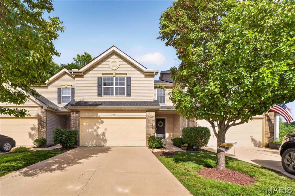 Welcome to 5545 Wavecrest Circle, where low-maintenance living meets modern comfort in an exceptional townhome offering 3 bedrooms, 3 full bathrooms, and 1 half bathroom in a peaceful, private setting. Designed with an inviting open-concept floor plan, this home is ideal for everyday living and effortless entertaining. The updated kitchen, featuring a spacious center island, abundant cabinetry, generous counter space, and a seamless flow into the dining and living areas, creates the perfect gathering space for family and friends. The spacious layout offers three generously sized bedrooms, including a Primary Suite with walk-in closet and bathroom. Bedroom #2 and #3 share a full hall bathrooms, while there is also a convenient main-level powder room and full bathroom at the finished lower level, providing flexibility for family, guests, or work-from-home living. The finished lower level expands the home's living space with a recreation room centered around a wet bar, making it the perfect destination for game days, movie nights or hosting guests
Windows and the sliding door fill the home with natural light while showcasing the private backdrop beyond - the newer deck and stairs with stylish balusters overlooking a tree lined setting. Perfectly located just minutes from the heart of Cottleville, the townhome is close to the charm of Cottleville's historic Main Street, with local favorites including Frankie Martin's Garden, Bemo's Grill, Mannino's Market, boutique shopping, coffee shops, restaurants, parks, and year-round community events. Convenient access to major highways, shopping, and top-rated amenities makes this an outstanding place to call home. The low-maintenance townhome lifestyle, allows for more time to enjoy everything Cottleville has to offer. The townhouse offers a combination of updated finishes - hardwood floors at the main floor, LVP at the finished lower level, cabinet hardware and some newer lighting fixtures.  With it's functional living space, setting, and an unbeatable location, 5545 Wavecrest Circle is the perfect place to enjoy carefree living without sacrificing style or convenience.