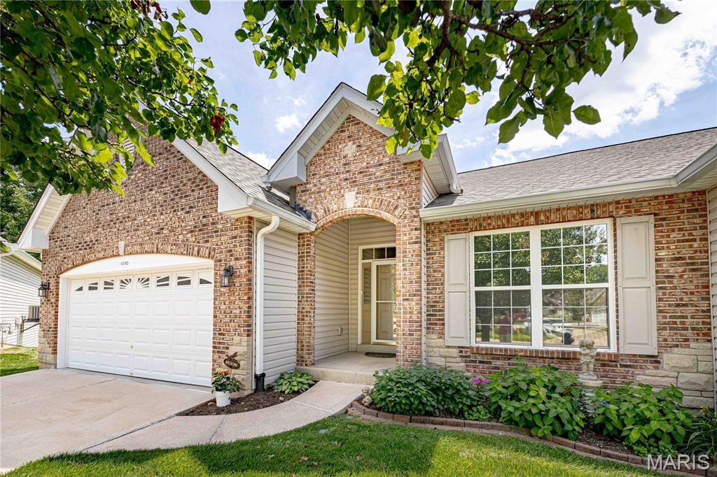 Showings Begin Friday June 26th - Nestled in a quiet Community of charming brick and stone elevations, this immaculate Villa offers lots of natural light and beautiful updates. A cul-de-sac location with ample rear and side yard (maintained), and privacy with wooded views. The wonderful open floorplan flows easily as you pass the open foyer and view the impressive Great Room with architectural features in the soaring ceiling, lots of light, fireplace and space to place even your largest furniture.
The Kitchen, with plenty of cook, storage & gathering space opens to the Breakfast area and seamlessly into the cozy "Sunroom" offering a bonus room in this floorplan, with fully finished, insulated, and conditioned space. Perfect to enjoy views all-around of the private and peaceful yard, treelined surroundings, games, or any favorite pastime. 
This 3+ Bedroom, 3 Bath Villa features a wonderful Main Suite with large bay, offers an updated Bathroom with a stunning, CUSTOM curb-less, oversized walk-in shower, stylish double vanity, private toilet area and enough closet space to make anyone smile.  
The 2nd Bedroom and Updated Bath are on the opposite side of the main floor for ample privacy and flexible space.
The finished Walk-Out Lower Level boasts a wonderful Family/Rec Room complete with a Wet Bar/Kitchenette. A 3rd Bedroom, with views of the rear yard, and full 3rd Bath are also in the spacious Lower Level.  The additional Bonus Room/Office/Flex space rounds out the finished area.  But don't forget the Workroom/Craftroom, perfect for any need or hobby, complete with sink, shelving and workbench areas and enough space for any project.  
The covered Patio invites to entertain or just sit a spell and enjoy the manicured grounds and lush greenscape.
Detailed and classic updates, fresh paint throughout, loads of storage areas and pride of ownership make this a place to call Home!