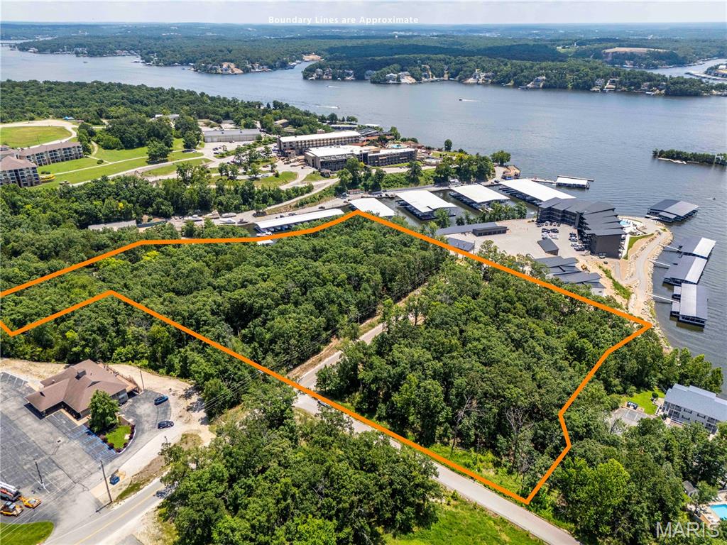 AUCTION LISTING - List price is not indicative of Seller’s final reserve amount.  This property is part of an online bidding event.  This sale will be executed with a no-contingency contract provided by the brokerage representing the Seller. See MLS Supplement Document for complete details. 

Vintage Landings - An Exclusive Development Opportunity at Lake of the Ozarks

Opportunities of this caliber rarely reach the open market. Vintage Landings sits just off Horseshoe Bend in the heart of the Lake of the Ozarks, offering 8.45± acres of prime development ground in one of the most established and sought-after corridors on the water.

The location speaks for itself. The property lies adjacent to the renowned Lodge of Four Seasons Hotel and marina and directly across from the picturesque Cove golf course, placing it at the center of everything that has made this stretch of the Lake a destination for generations. It neighbors The Havens, a brand-new luxury condominium development, and puts top-rated golf, dining, shopping, nightlife, and entertainment within easy reach.

For a developer or investor, the appeal is straightforward: a well-positioned, ready-to-build canvas in a market that continues to grow. The Lake of the Ozarks remains one of the Midwest's premier recreational destinations, and ground of this quality in this setting does not come available often.

Offered as one unit totaling 8.45± acres, Vintage Landings will sell at auction. This is a rare chance to secure a foothold in one of the Lake's most desirable settings.

PROPERTY DETAILS
5.18± acres:  Parcel ID 01-8.0-27.0-000.0-014-002.005
3.27± acres:  Parcel ID 01-8.0-27.0-000.0-014-002.006