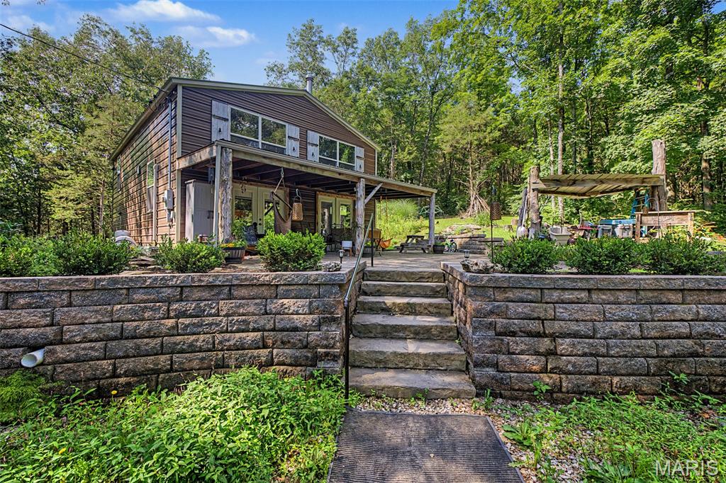 UNIQUE AND PRIVATE.  LOCATED ON 4.87 ACRES SURONDED BY NATURE AND BEAUTY. 3 BEDROOM, 1 FULL BATH ROOM. HEATED AND AIR CONDITIONED WITH A SPLIT UNIT. HOME IS 1248 SQUARE FEET. THIS RUSTIC HOME IS A ONE OF A KIND.. SPRINGS RUN THROUGH THE PROPERTY. THIS IS A MUST SEE. NOT A DRIVE BY. REQUEST A PRIVATE SHOWING. LOCATED NEAR 
I-44 CORIDORI AND AMUSEMENT PARK, SHOPPING AND RESTAURANTS. HAVE THE PRIVACY OF THE COUNTRY AND THE AMENITIES OF THE CITY.