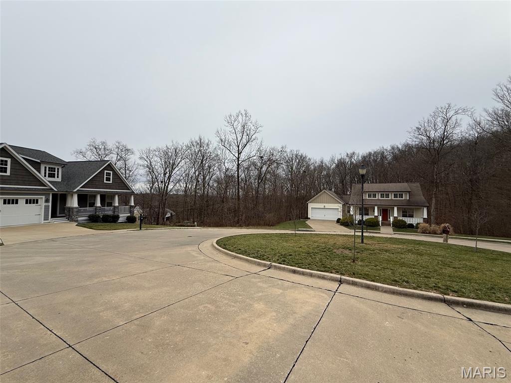 Enjoy a quiet setting in the wildly popular Walden Park in the exclusive wooded cul de
sac of Brister Hill. A rare/walkout lot flaked by gorgeous homes and adjoining the Cape
County Nature Center Walking Trail awaits your dream home! Keep your bikes and
fishing gear in your lower level and head right out on the trail! If you’re not familiar with
all the community amenities of Walden Park, please ask for the full attachment with
details. The community pool and meeting room are great for events/parties and family
reunions. Spacious sidewalks, manicured lawns and green spaces make it obvious why
so many long to find a home in this neighborhood. They boast that the neighbors are
truly some of the very best Cape has to offer!
A local luxury home builder has been consulted and can answer questions you may have 
about building on this lot!