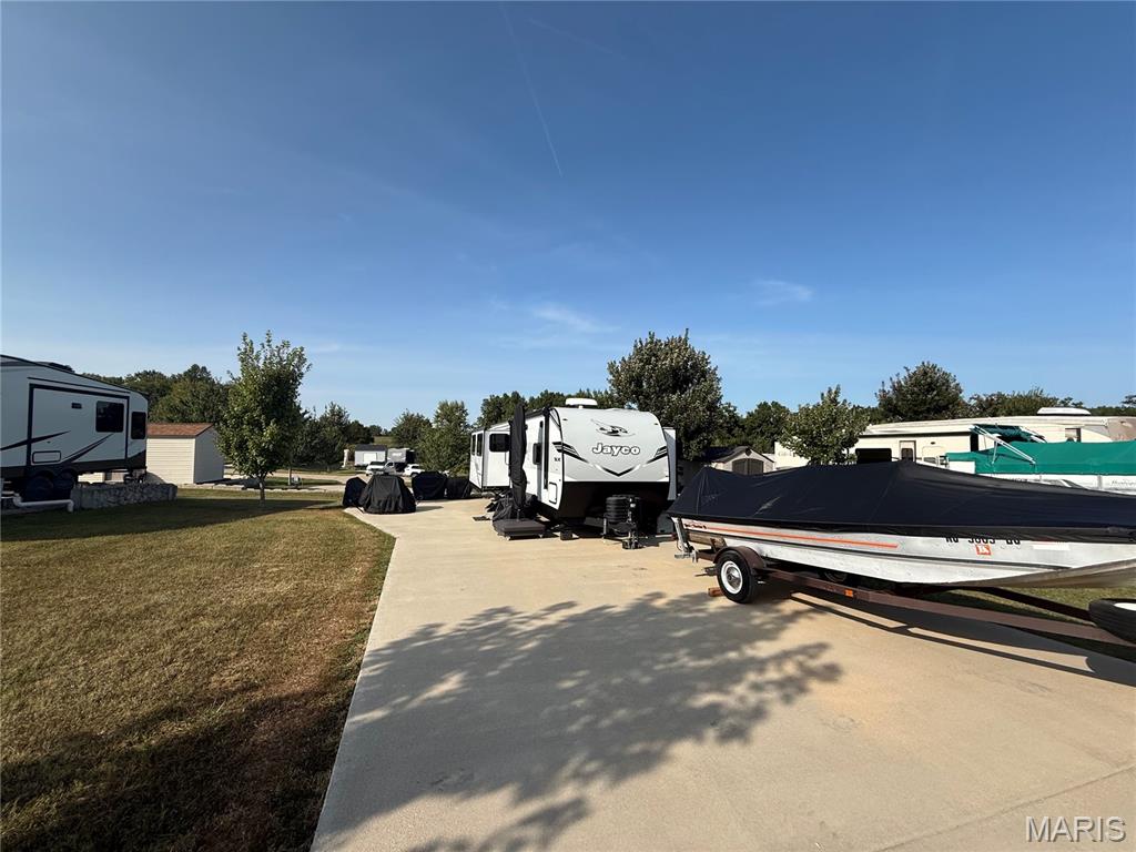 Discover your getaway spot at Adventure Out RV Park in Monroe City! This 50x100 paved lot #66 is ideal for your RV, offering plenty of room for setup, outdoor seating, and parking. With a paved surface, you’ll enjoy easy maintenance and convenience during your stays.
Adventure Out RV Park is open March through November, making it the perfect seasonal retreat near Mark Twain Lake. The park also provides maintenance services for your RV or camper right on-site. Enjoy fishing, boating, and all the local attractions just minutes away. Whether you’re looking for a weekend escape or a summer-long stay, this lot provides a comfortable, hassle-free base in a welcoming community. Camper & contents, not included. Seller Financing Available! Just 10% down with financing available for up to 180 months at 8% interest. Monthly payments start at approximately $480/month. Multiple lots are available in the campground- call today!