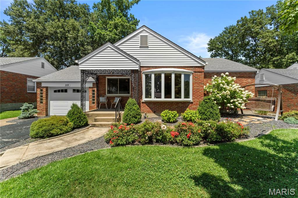 Welcome home to this charming Webster Groves gem offering 3 bedrooms, 2 full baths and over 2,200 square feet of living space! The bright living and dining rooms feature both a beautiful bay window and large picture window, filling the space with natural light.

The updated kitchen offers abundant cabinetry, convenient pantry pull-out drawers, and plenty of storage, with a large sliding glass door leading to the fenced backyard and patio—perfect for grilling, entertaining, or relaxing outdoors.

Just off the kitchen, the cozy family room features a fireplace and windows on two sides, providing a warm and inviting space to gather.

The finished lower level adds even more living space with a spacious recreation room, a second full bathroom, and a bright laundry area with storage and a workspace. Additional features include a three-zone heating system for year-round comfort and glass block basement windows.

Located in a quiet, established Webster Groves neighborhood close to parks, schools, shopping, and dining, this move-in ready home offers the perfect combination of space, charm, and convenience. Don't miss your change to call  219 Sunningwell Home!